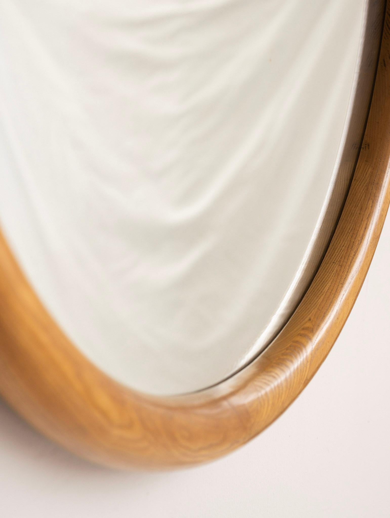oak framed round mirror