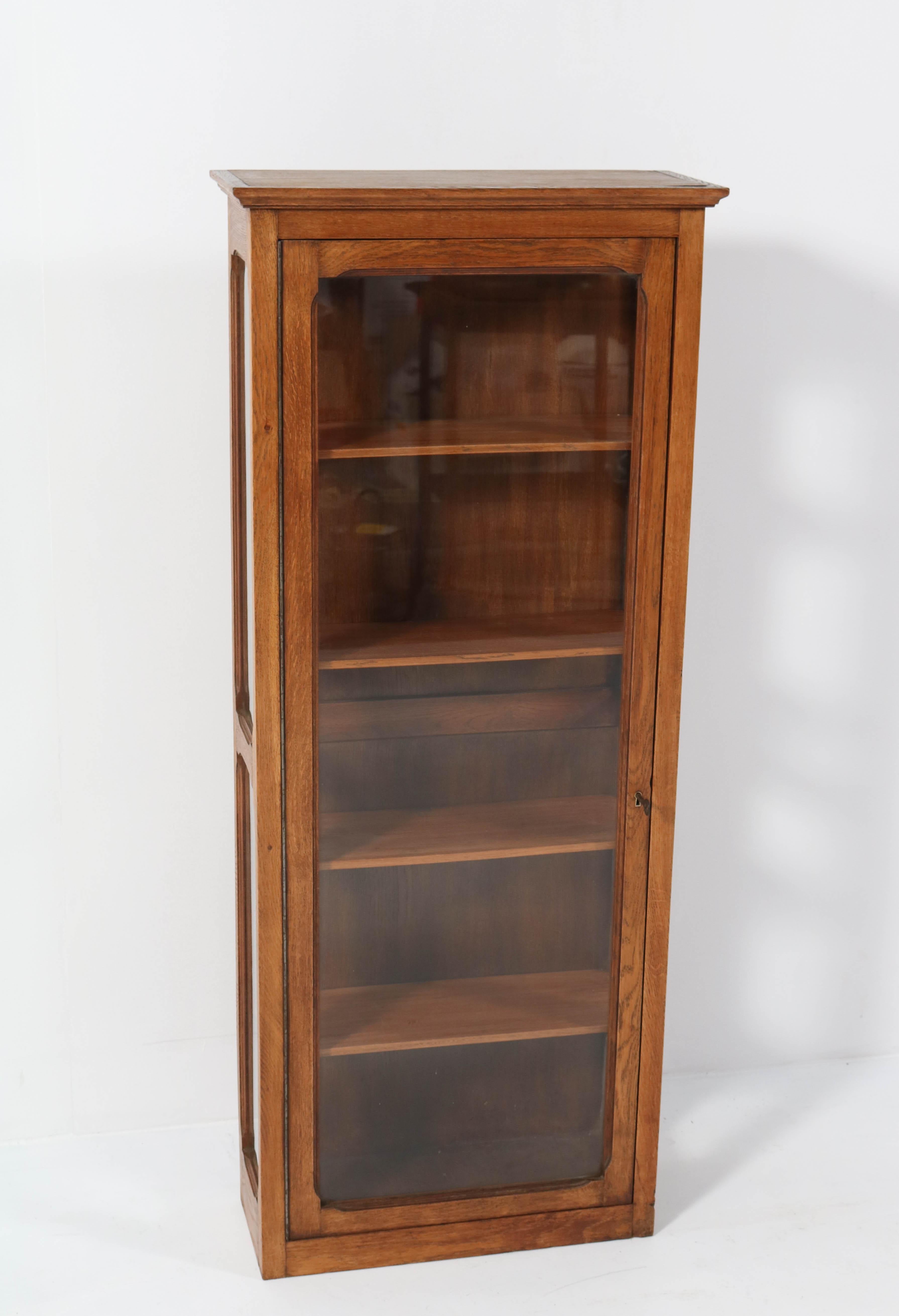 Stunning Art Nouveau wall display cabinet.
Striking French design from the 1900s.
Solid oak with four original wooden shelves.
In very good condition with minor wear consistent with age and use,
preserving a beautiful patina.