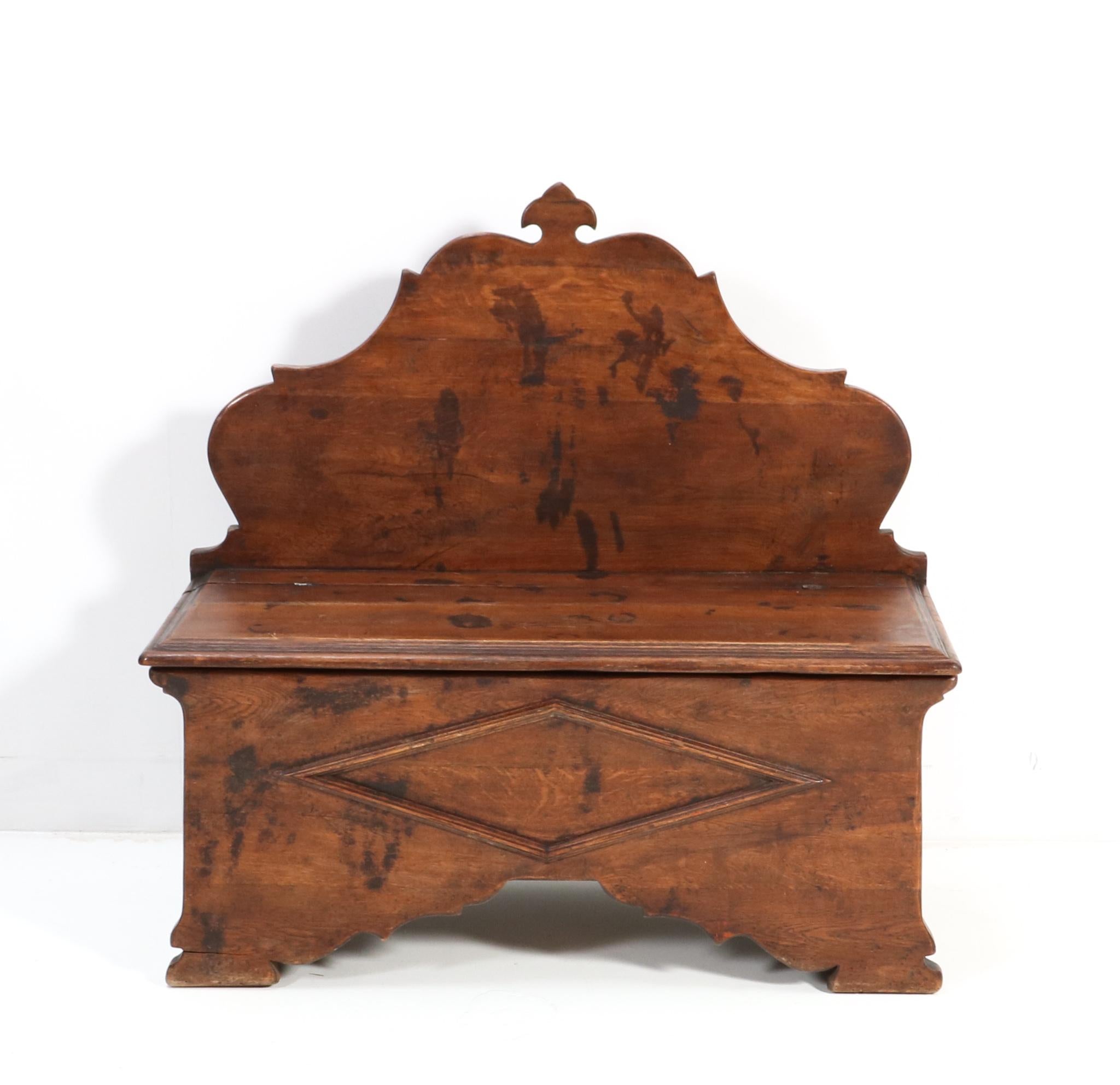 Stunning French Provincial rustic hall bench.
Striking French design from the 1900s.
Solid oak frame with storage space underneath the seat.
This wonderful French Provincial has a rustic look and is very good condition with a beautiful patina.