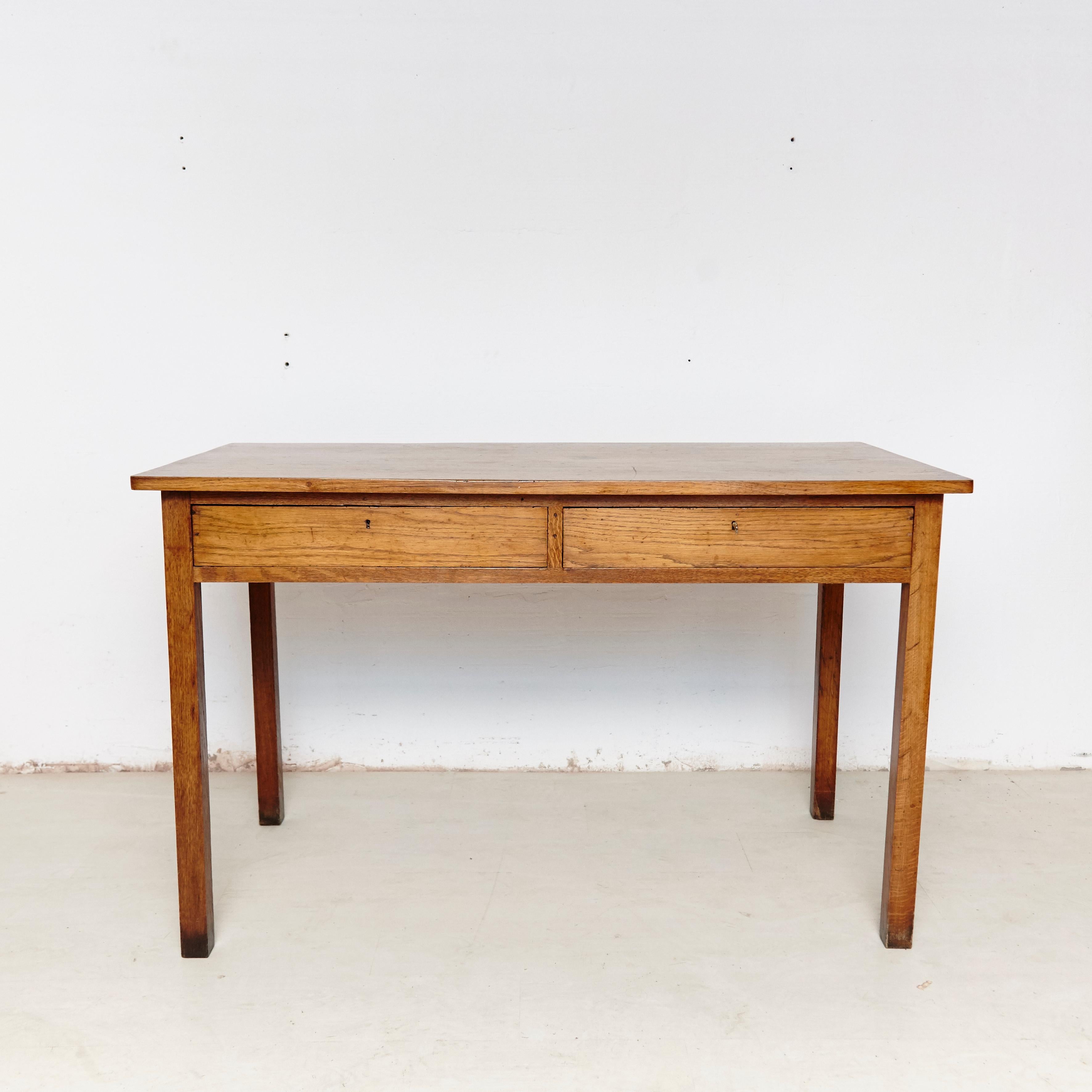 Oak French table, circa 1930
By Unknown designer.
Manufactured in France.

In original condition, with minor wear consistent of age and use, preserving a beautiful patina.