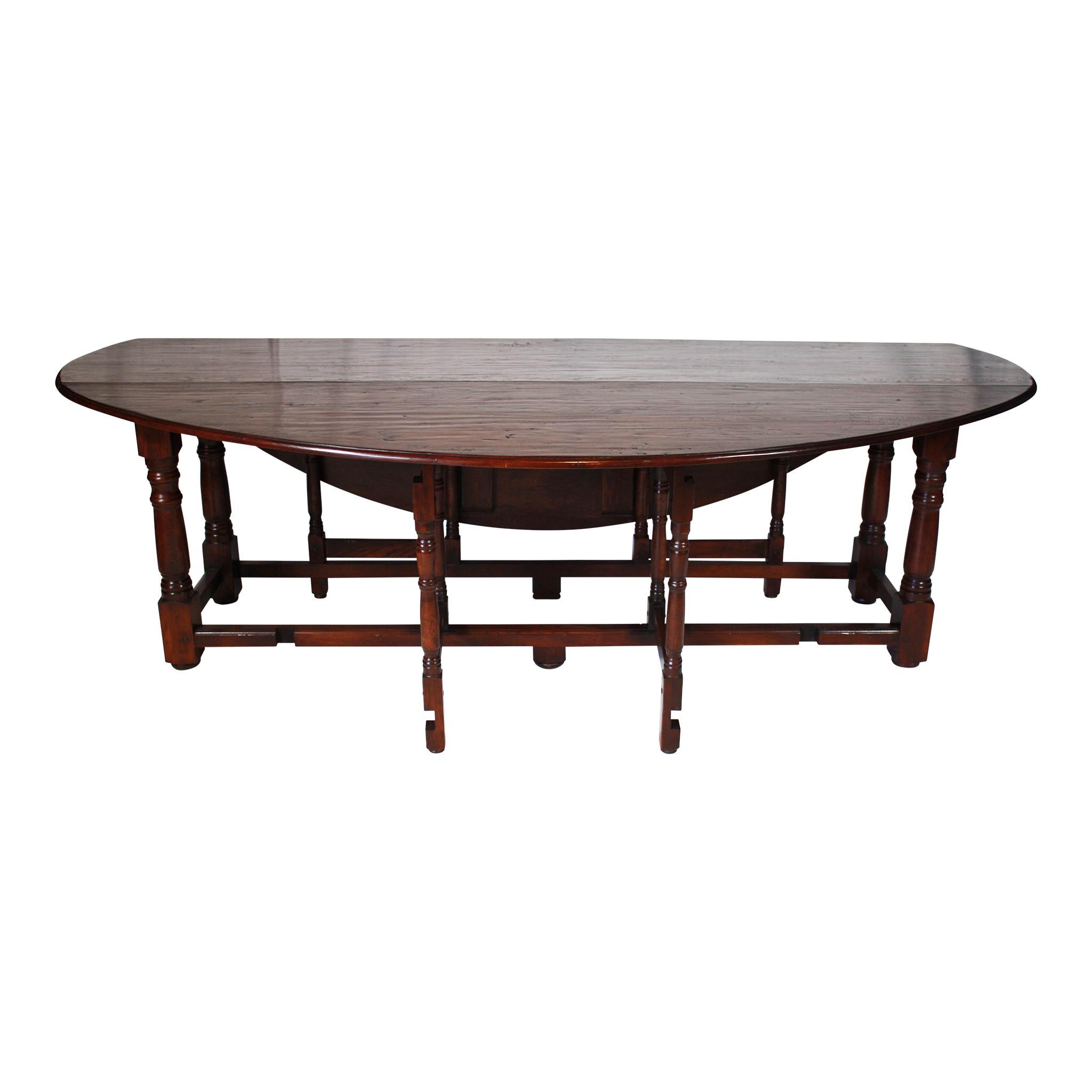 Over eight feet in length, this hand hewn oak table has gate legs that fold in or out for just the right amount of space. The width of the table with the gate legs closed is 24 inches.