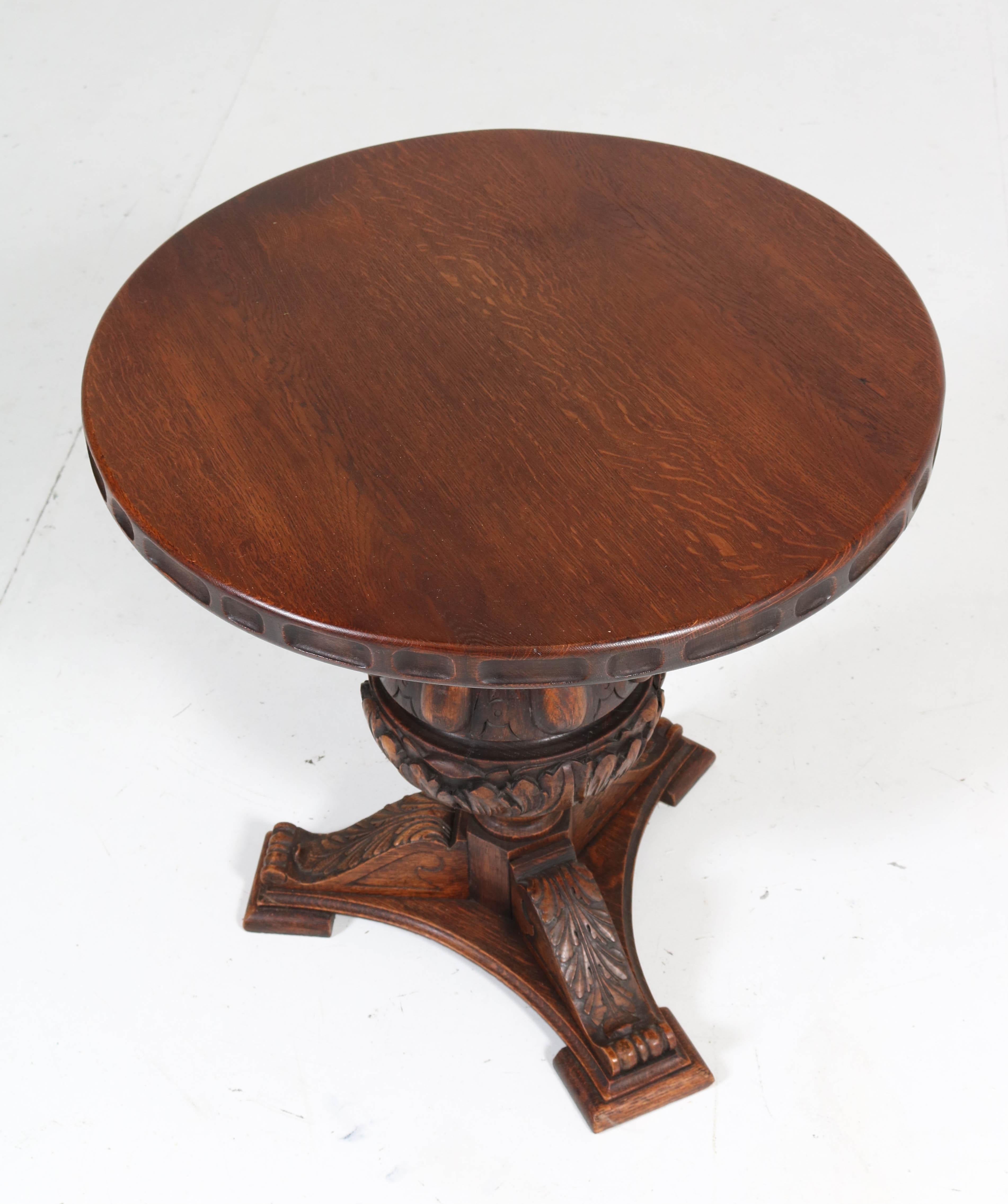 Wonderful Gothic Revival side table.
Solid oak carved base with solid oak top.
In very good condition with minor wear consistent with age and use,
preserving a beautiful patina.