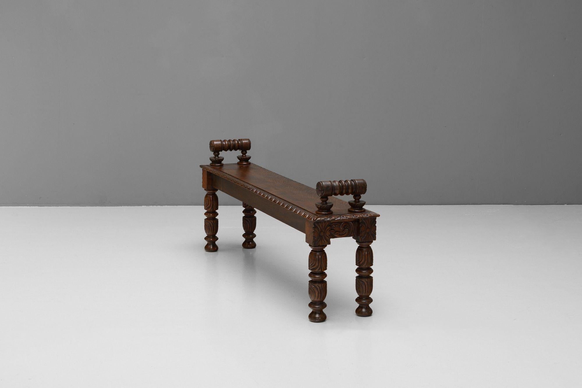 Carved oak hall bench. Circa 1890.

H 56cm (SH 43cm) x W 140cm x D 29cm