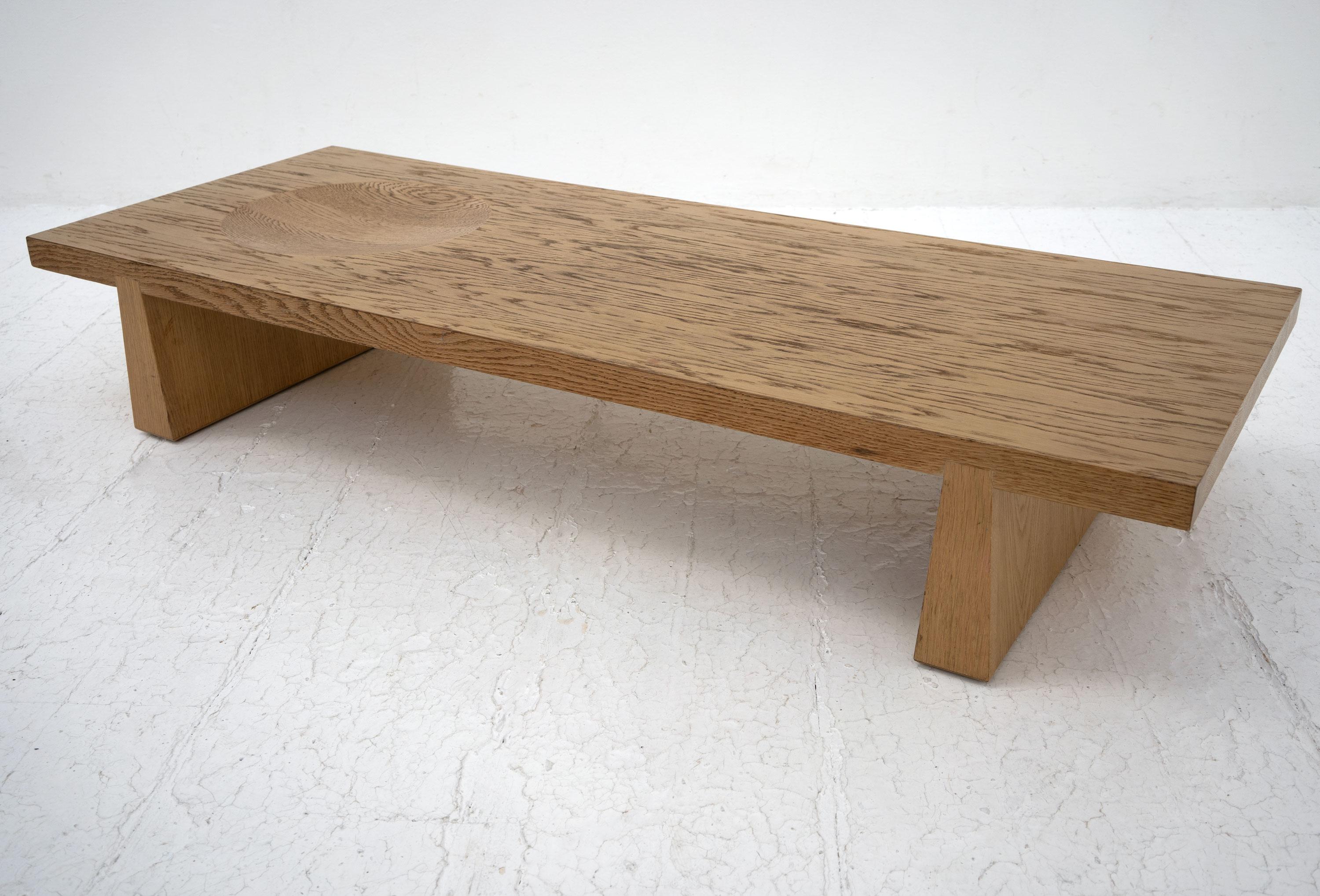 A vintage Japanese style coffee table made from oak and featuring an inset bowl.

Dimensions (cm, approx):
Height: 28
Width: 120
Depth: 54 