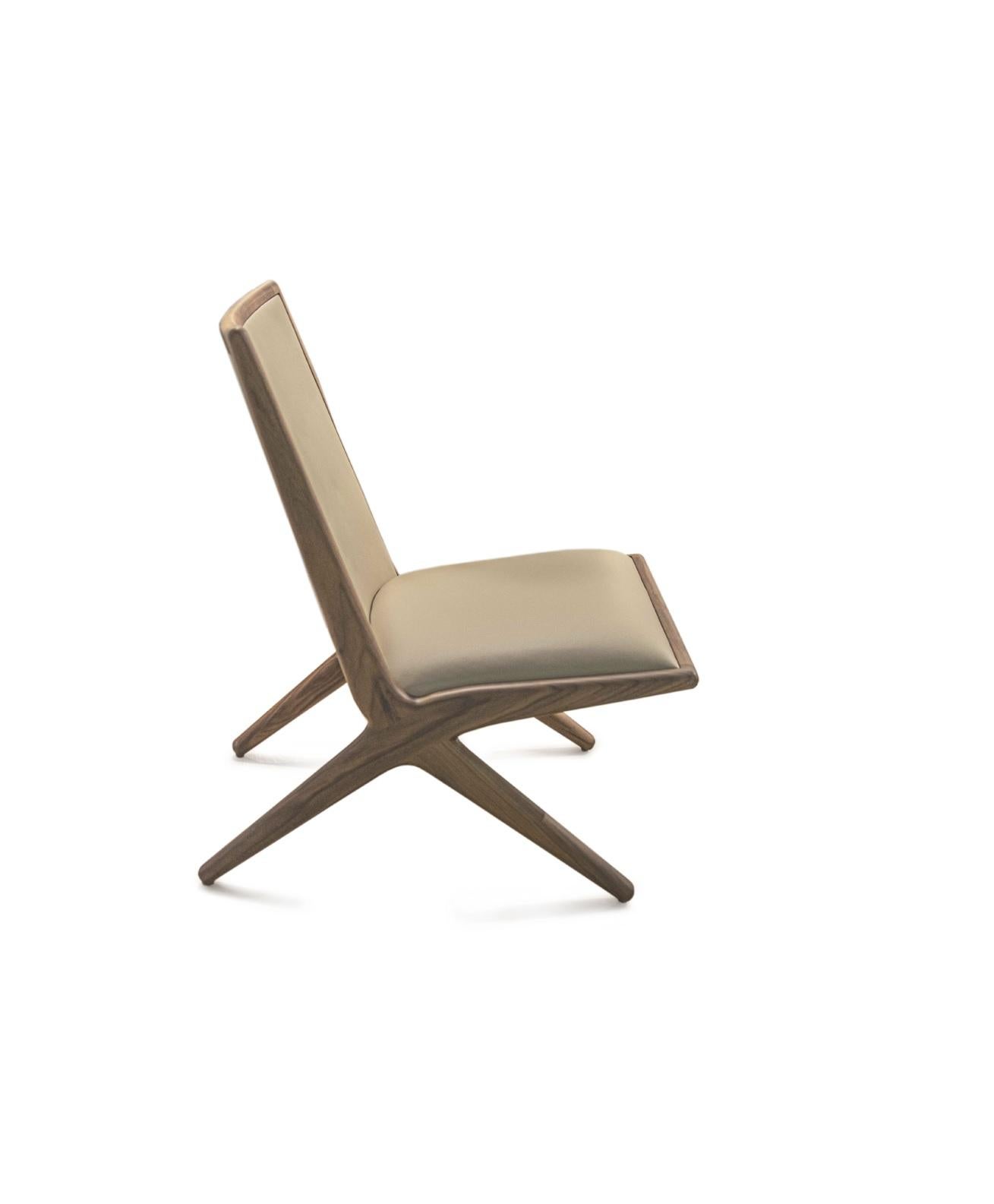 Oak Kaya lounge chair by LK Edition
Dimensions: 75.7 x 68 x H 86.3 cm
Materials: Oak. Leather. 
Also available in walnut and without leather.

It is with the sense of detail and requirement, this research of the exception by the selection of