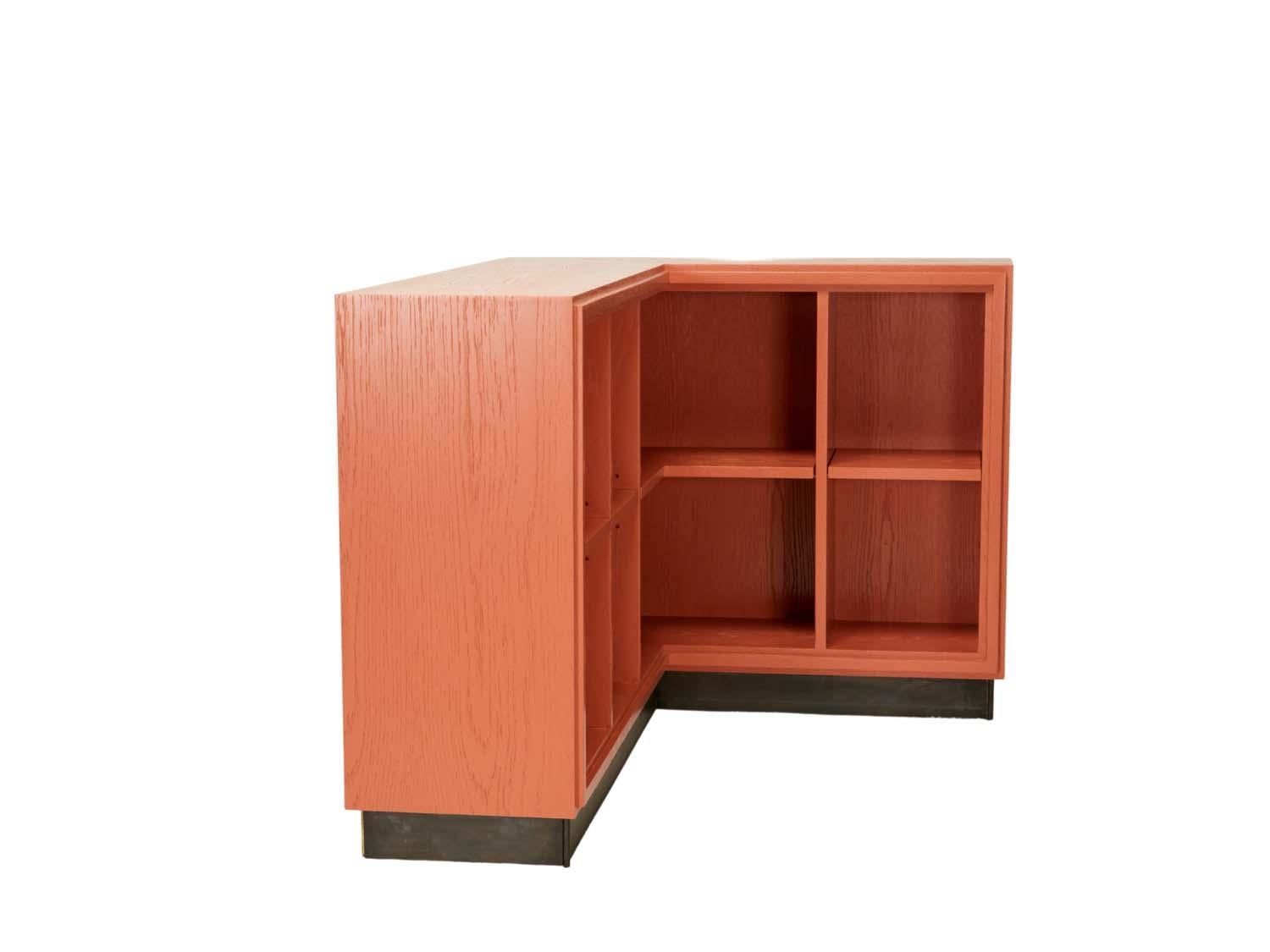 Oak L-shaped corner shelf unit.