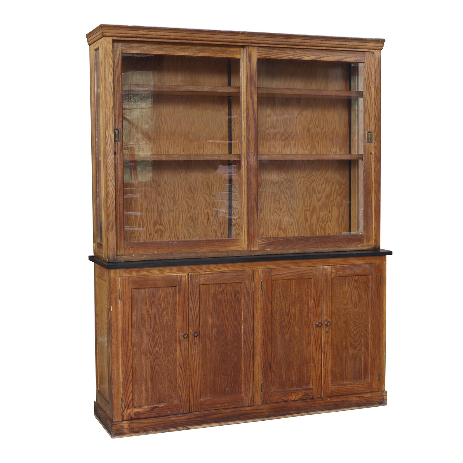 A fantastic early 20th-century laboratory storage cabinet in great condition, this piece is great for storage with visible display shelves in the upper cabinet and hidden options in the lower.

*Cabinet can be separated into upper and lower