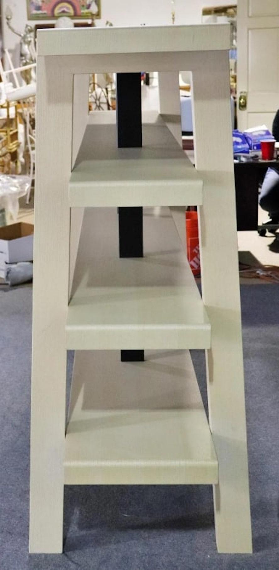 Modern four shelf standing bookcase, made of bentwood panels of laminate oak. Metal supports connect the shelves for a sturdy unit.
Please confirm location NY or NJ.