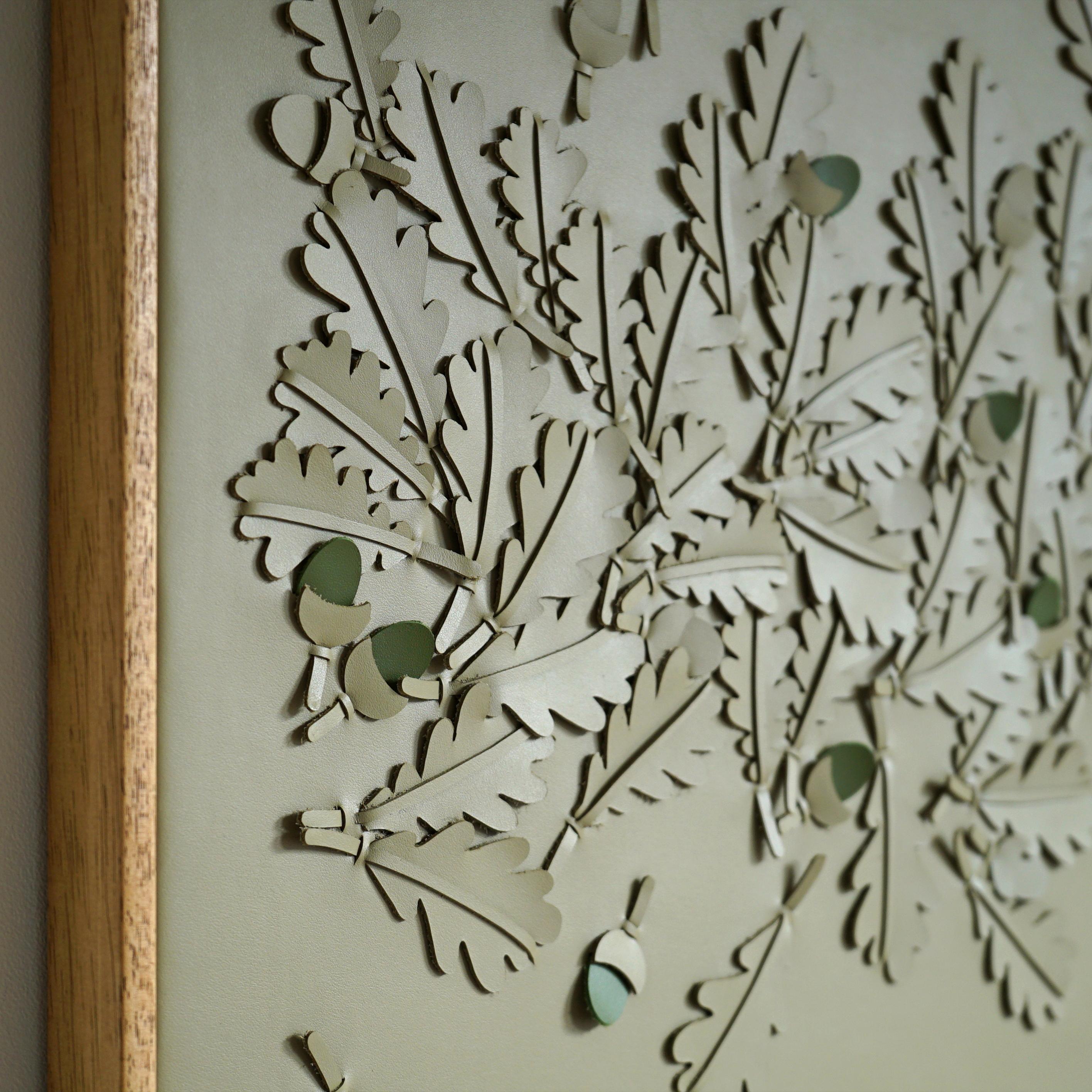 Oak leaves.

A piece of 3D sculptural wall art designed and made from two layers of green leather, woven together by Louise Heighes. 
Measurements are 21 x 21 inches or 54 x 54 cm.

​This piece is inspired by the dancing leaves of the oak tree that