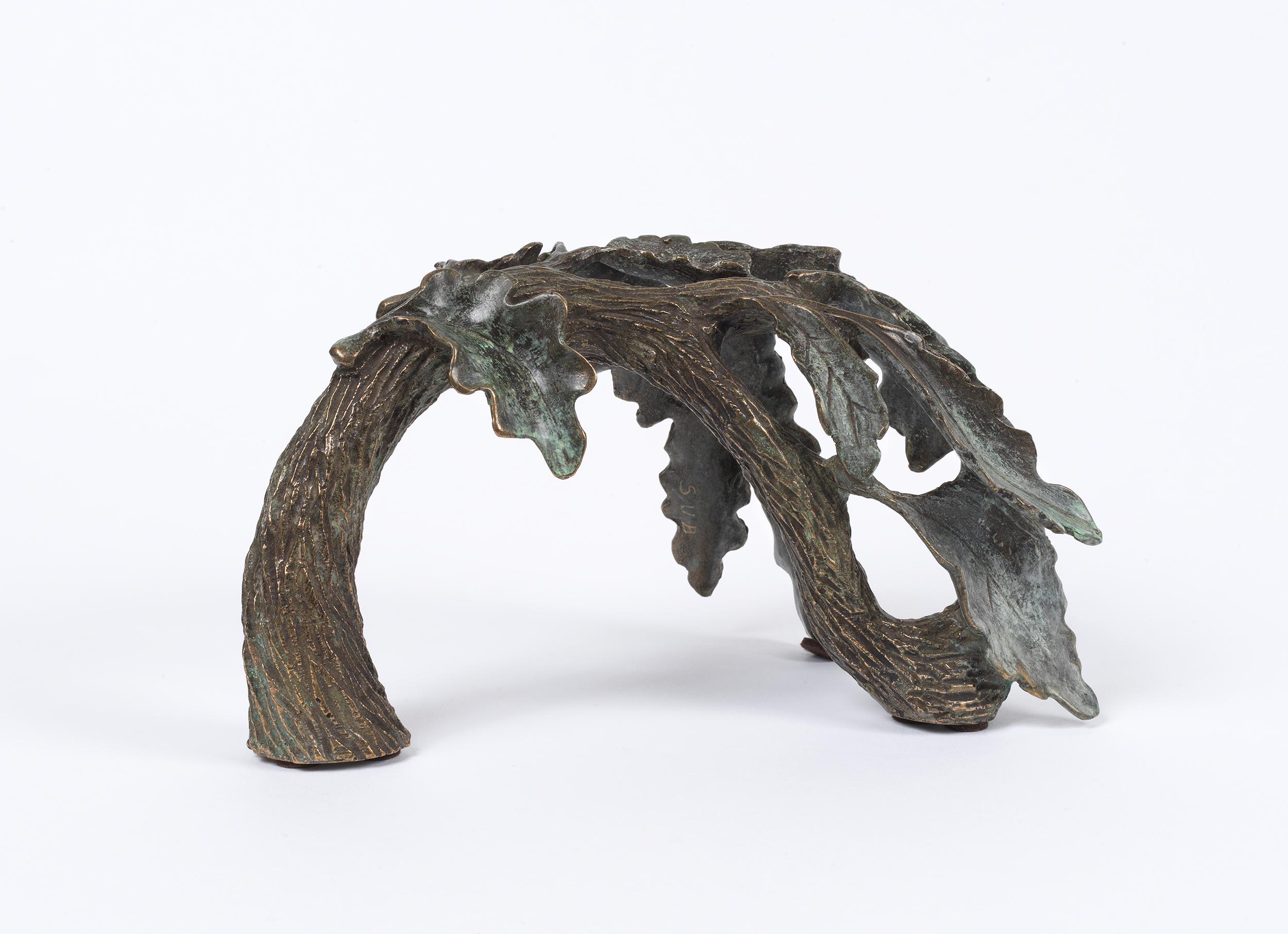 A beautiful branch of oak leaves cast in bronze. Made with the ancient lost wax method, a process dating back to the 3rd millennium BC, in which the oak leaves are carved in wax then set in clay. The wax is then melted and drained out leaving a