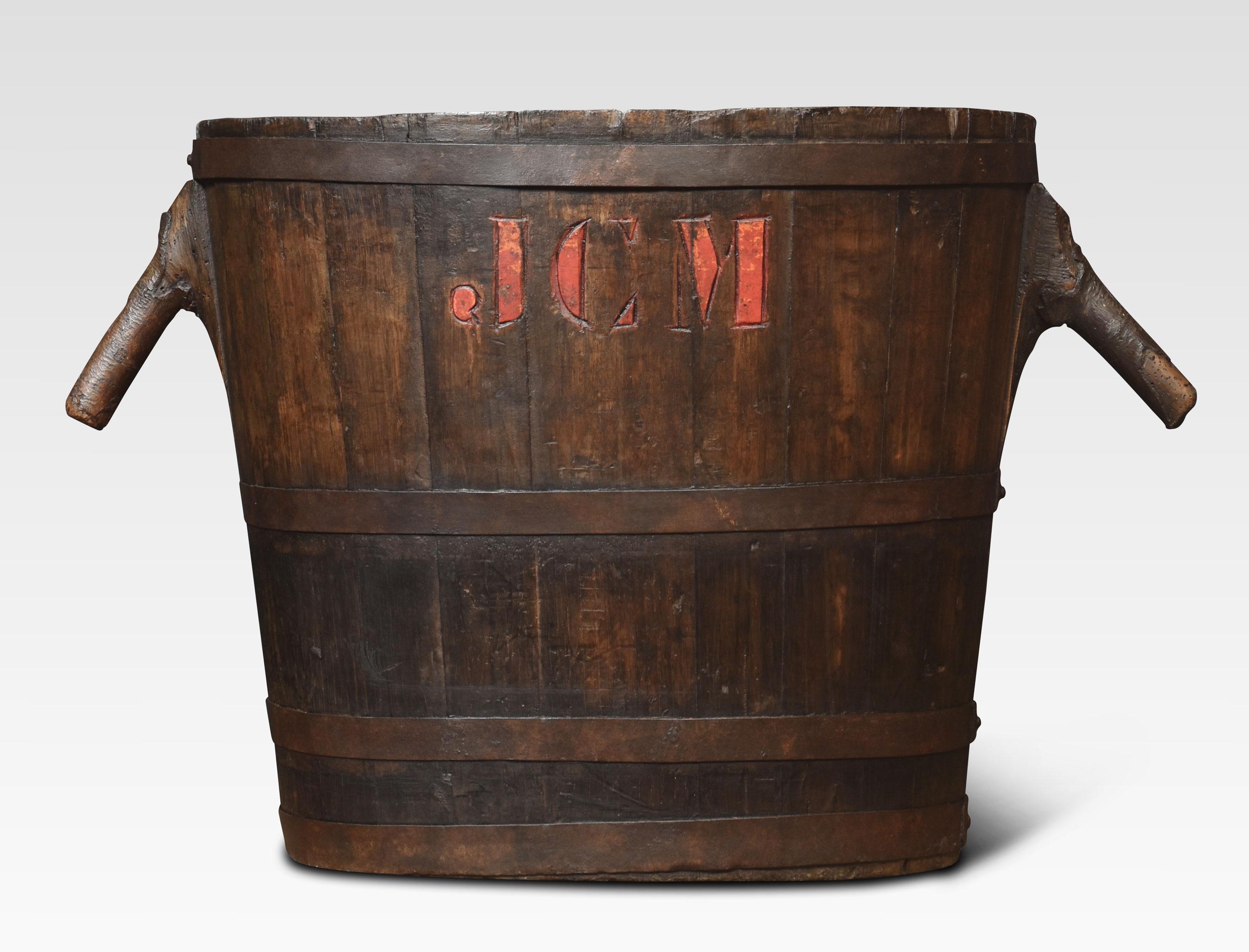 oval-shaped log bin the oak frame encased in iron bands having stylised handles.
Dimensions
Height 22 Inches
Width 35 Inches
Depth 18 Inches