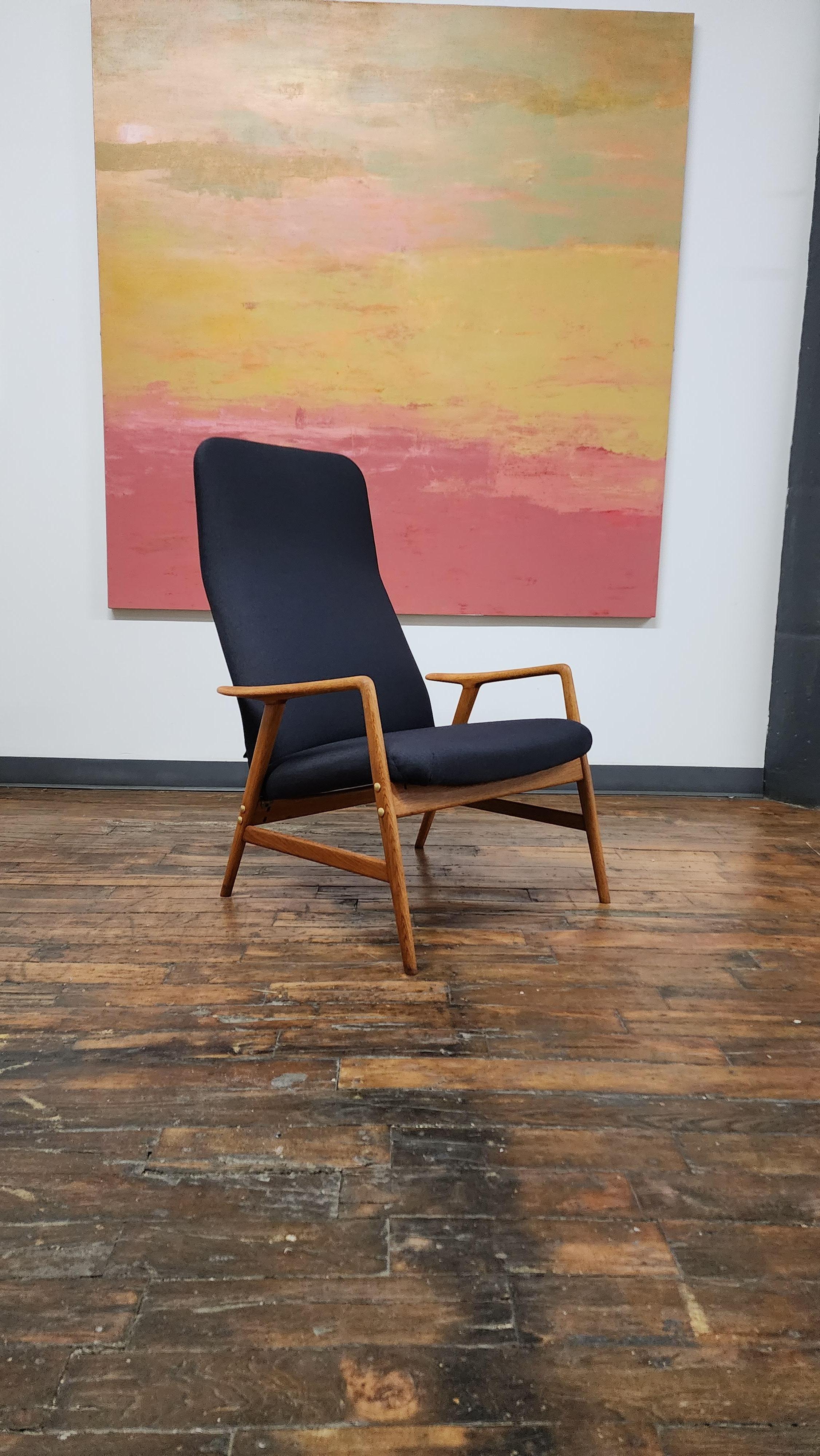 Beautiful oak adjustable lounge chair by Alf Svensson. seat position cab be adjusted to the upright or reclined position by lifting the back and adjusting where it rests on the rear stretcher.  new Upholstery and refinished oak frame.