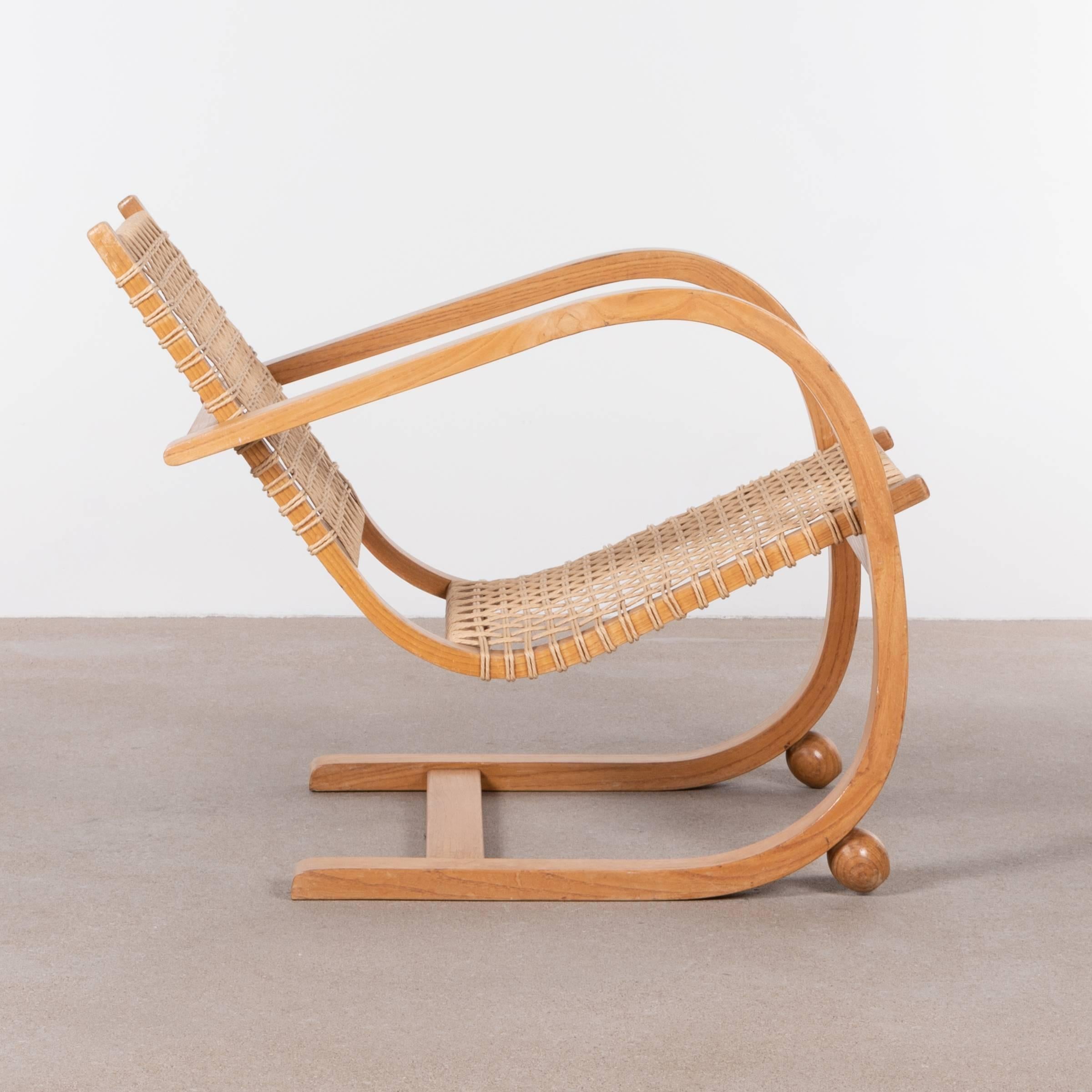 Stylish lounge chair in the manner of Bas van Pelt. Oak bentwood frame with woven rope seat/back. Only light wear and in very good condition. Rare find!