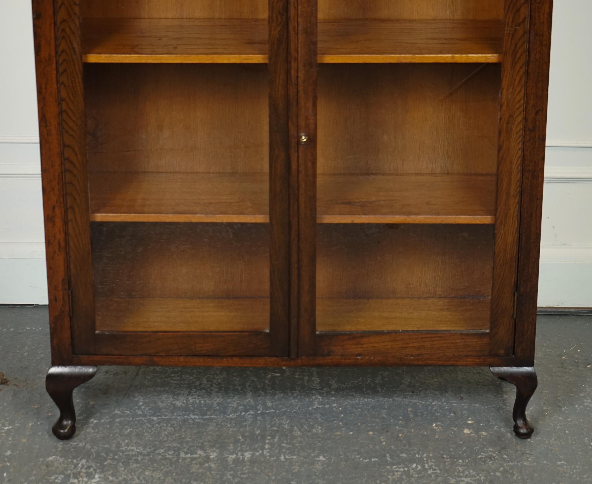 Hand-Crafted OAK LOW BOOKCASE WITH GLAZED DOORS ADJUSTABLE SHELVES AND CABRIOLE LEGS j1 For Sale