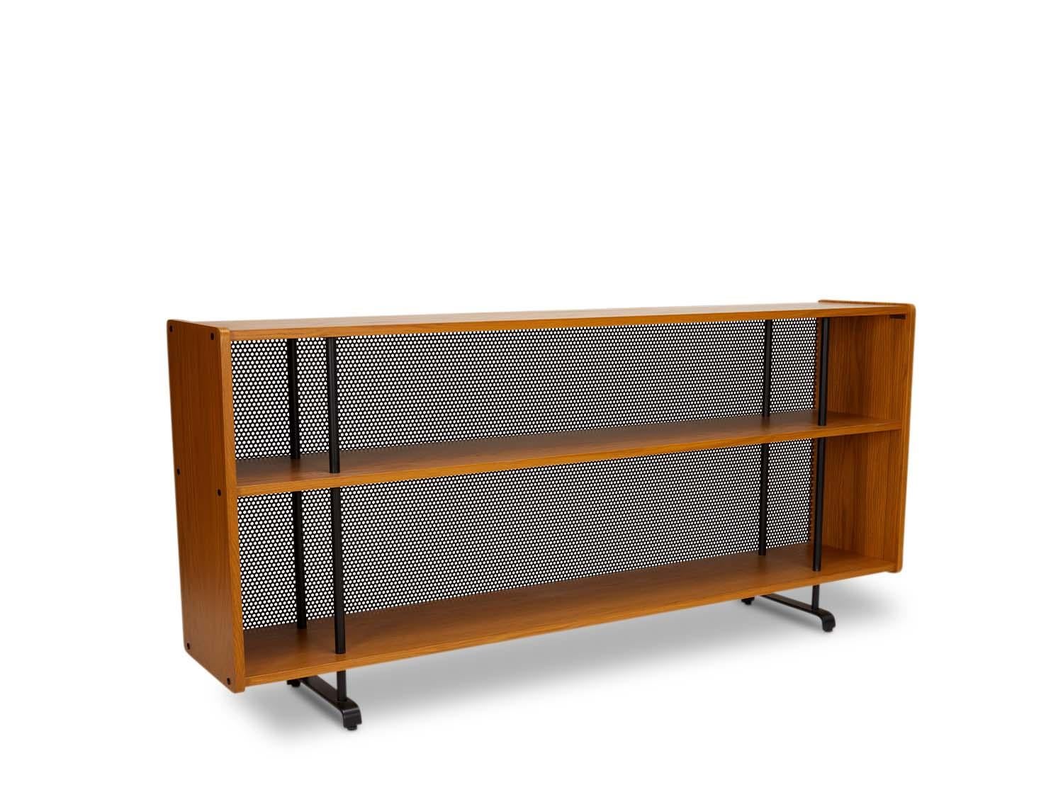 The Maker's console is made of American walnut or white oak and rests on a blackened steel base. Features two shelves and a perforated steel detail on the back. 

 