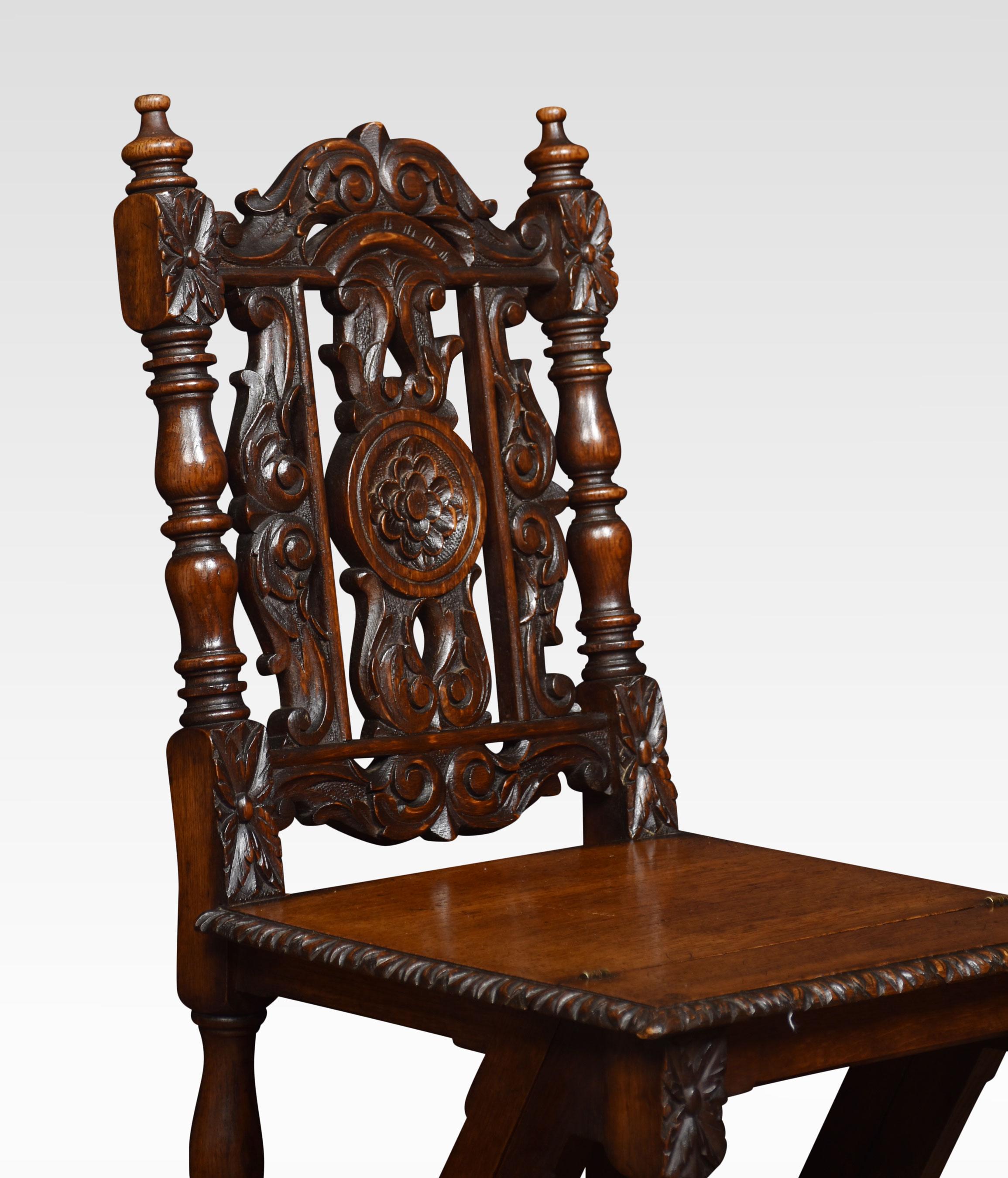 Oak metamorphic chair, in Jacobean style the panelled back with pierced decoration with scrolling foliage. To the solid oak hinged seat folding to form a set of library steps.
Dimensions
Height 37 Inches height to seat 18.5 Inches
Width 17