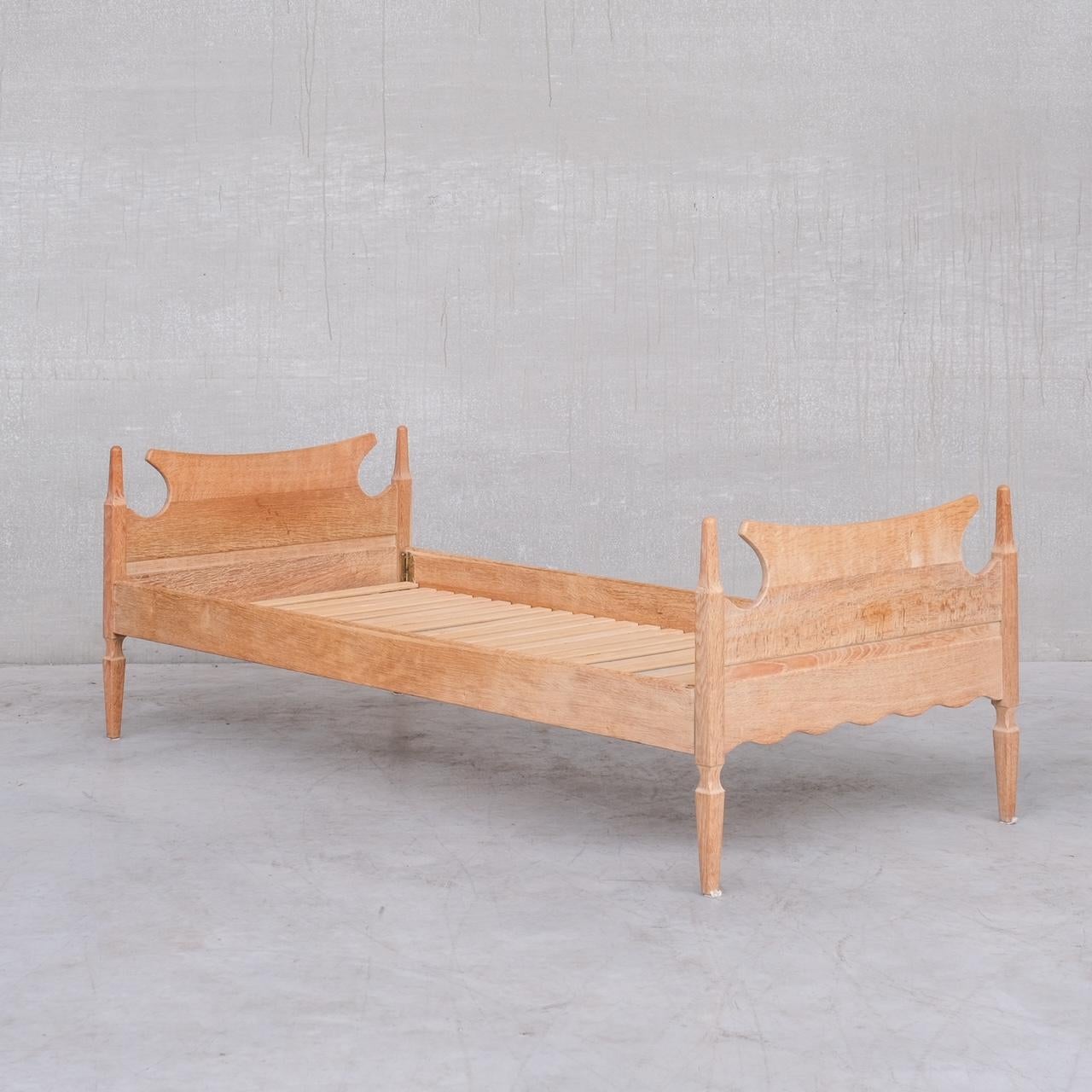 A light oak framed day bed or single bed. 

By Henning Kjaernulf. 

Denmark, c1960s. 

Sold as is, and priced accordingly, simply needs mattress or upholstered cushion to taste. 

Two available, priced and sold individually. 

Location: