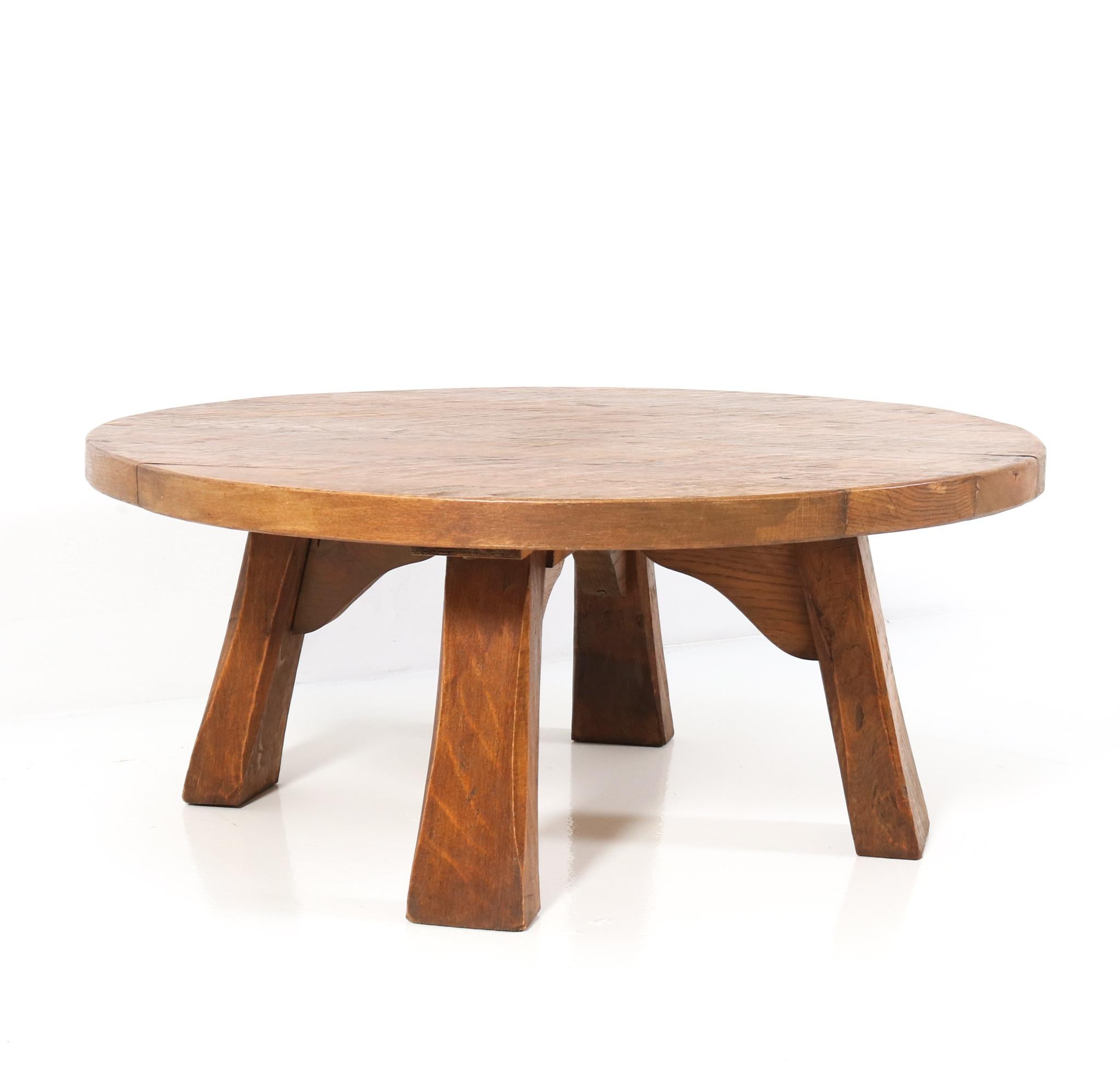 Stunning and rare Mid Century Modern Brutalist round coffee table.
Striking Dutch design from the 1950s.
Solid oak.
This wonderful Mid-Century Modern coffee table is designed in the 
Brutalist style.
The design of this Rustic coffee table is