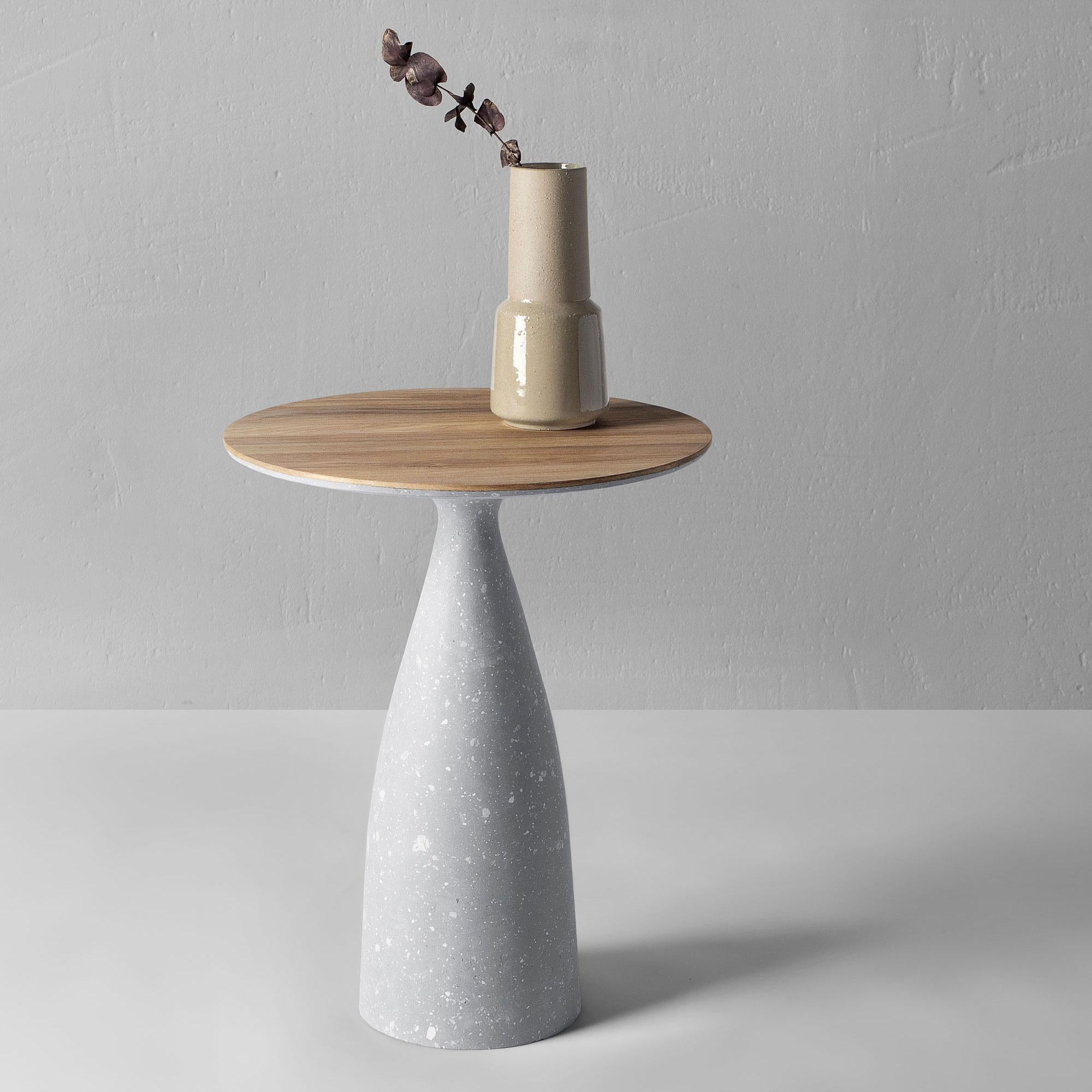 Minimalist side table 45, grey.

The visual inspiration for the side tables is a combination of natural wood and concrete. These two opposite materials combined, create a unique character of the product that has the coldness of concrete and the