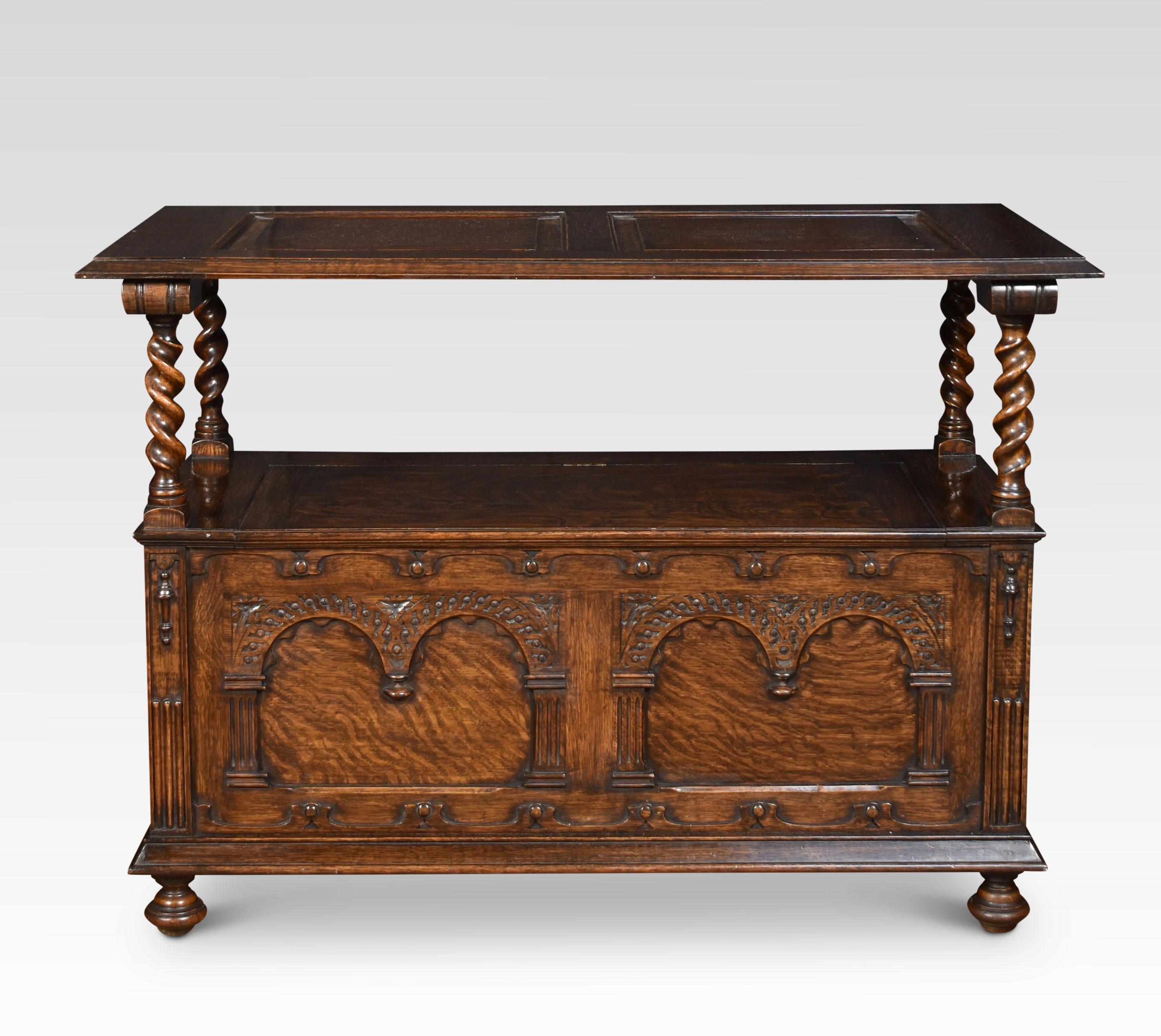 Carved oak monk’s bench/hall bench. The solid oak hinged top with arched carvings. To the raised arms with turned uprights. The solid oak seat is hinged and opens to reveal the uninterrupted storage space inside.
Dimensions
Height 39 inches height