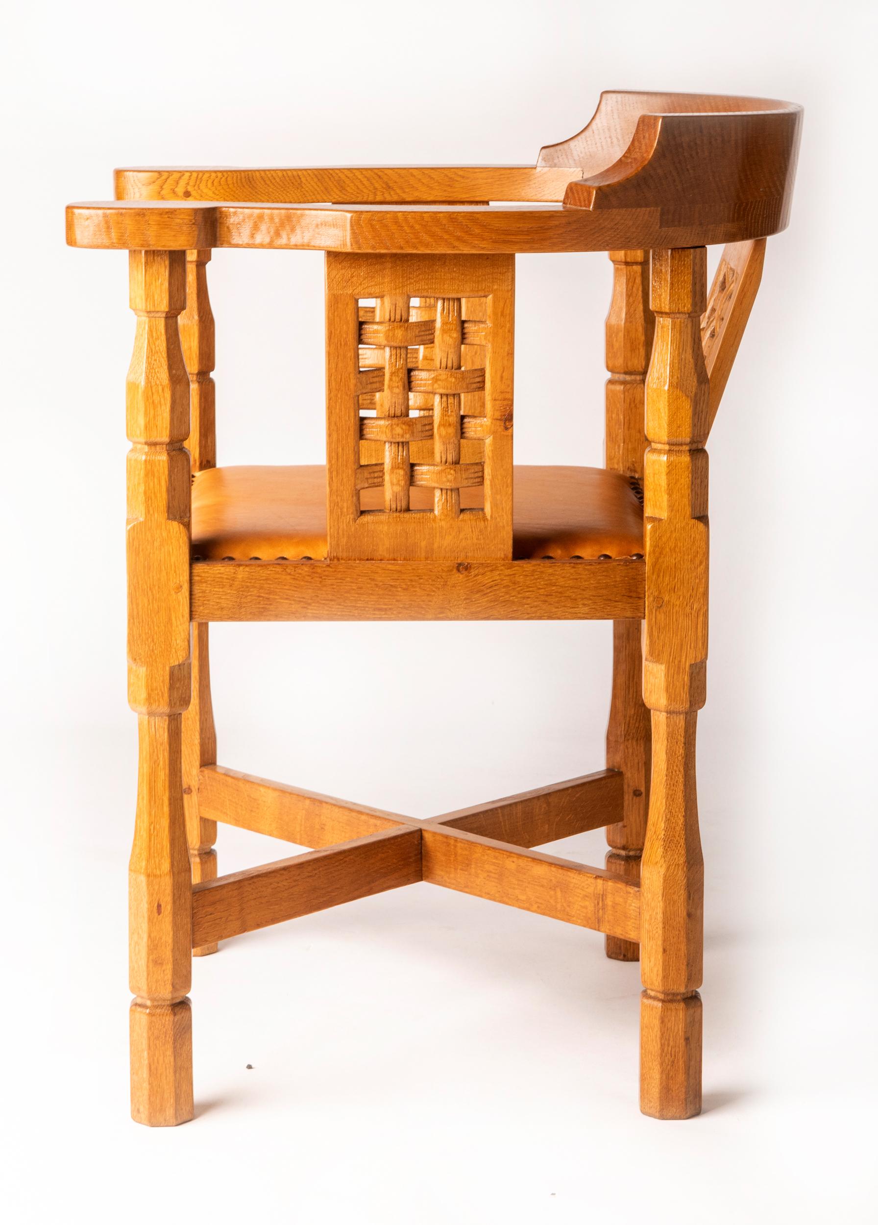 Oak Monk’s chair by Robert “Mouseman” Thompson
The curved back splat trellis woven pattern.
Leather seat above octagonal carved legs
Carved mouse signature.
England, circa 1950
Measures: 80 cm high x 62 cm wide x 45 cm deep.
  