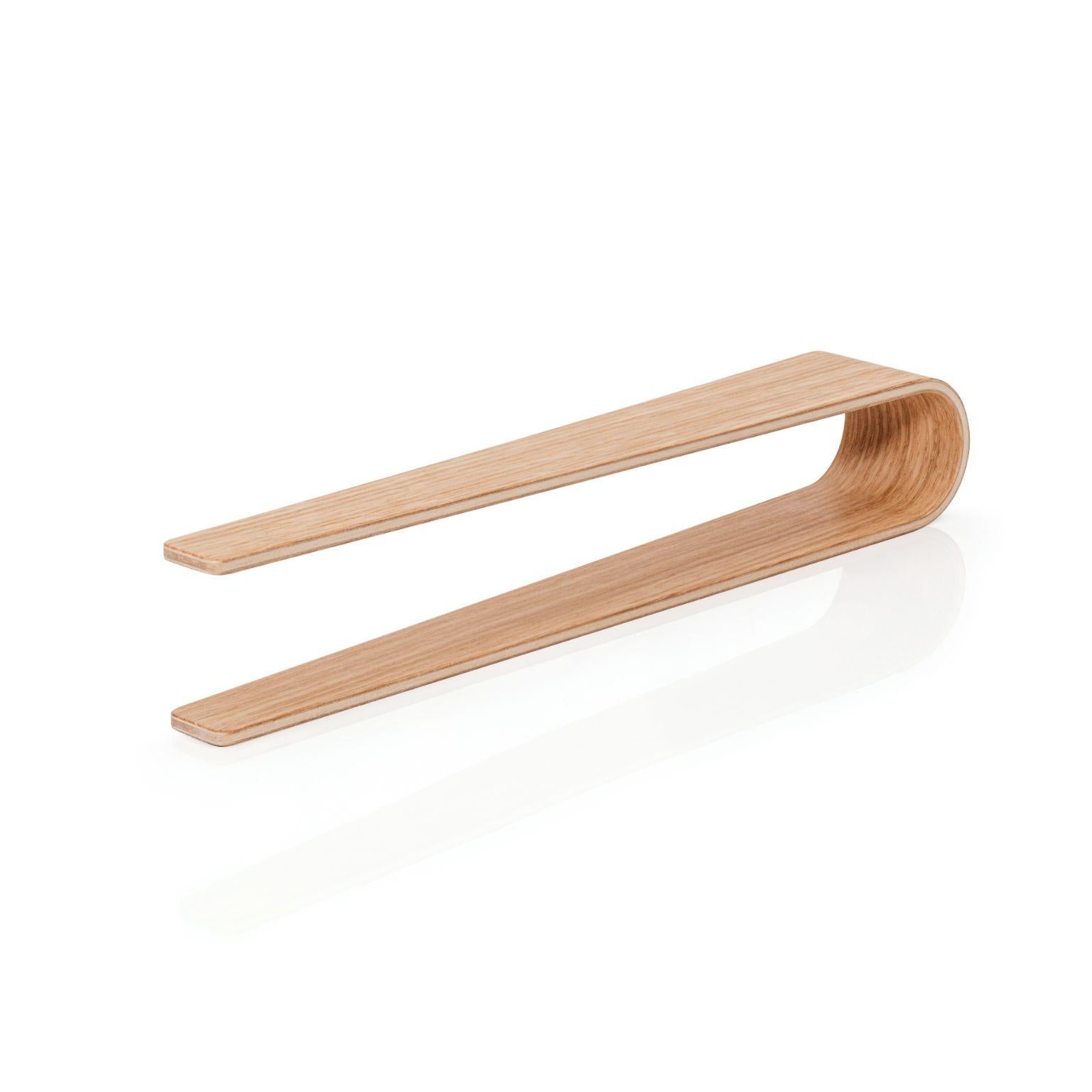 Oak Nokka tongs by Antrei Hartikainen
Materials: Walnut, maple, natural oil wax
Dimensions: W 24,5 D 4/2 H 6 cm

Also available in a variety of woods

Nokka tongs are suitable for serving a range of light foods including appetizers, salads, quiches,