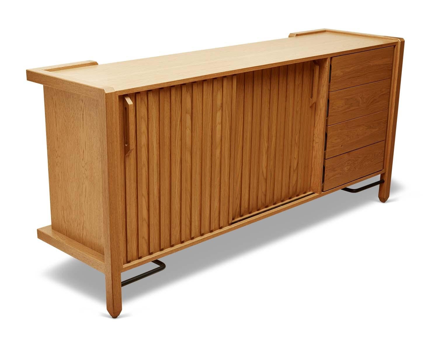 The Ojai credenza has four drawers and two bypass doors with open storage behind it. It has solid white oak or American walnut legs and case, and features a metal stretcher on the base.

The Lawson-Fenning Collection is designed and handmade in Los