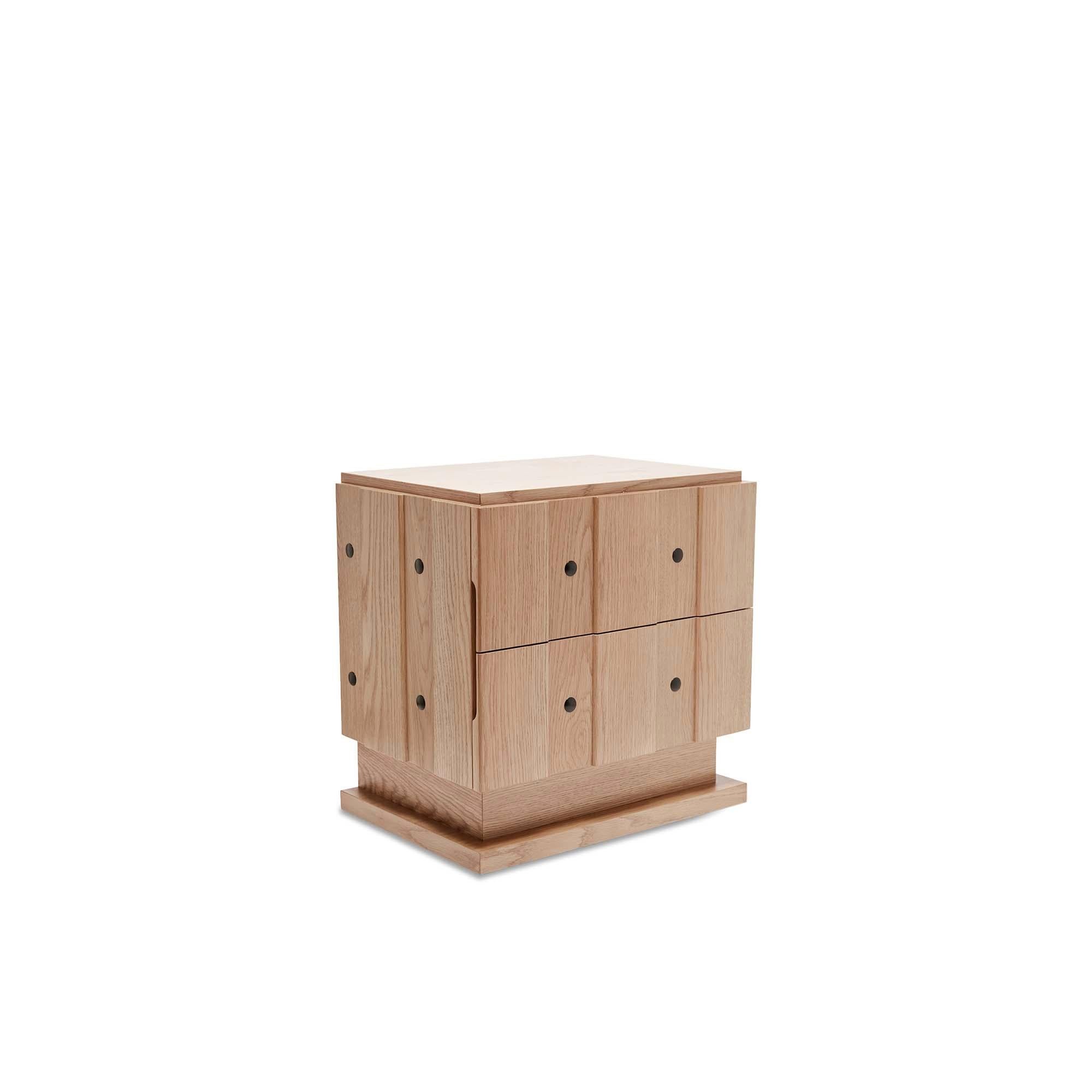 The Ojai Nightstand features board and batten doors with iron details and two drawers. Available in two sizes and in American walnut and white oak.

Inspired by the refined simplicity and subtle detailing of early 20th century Swedish furniture