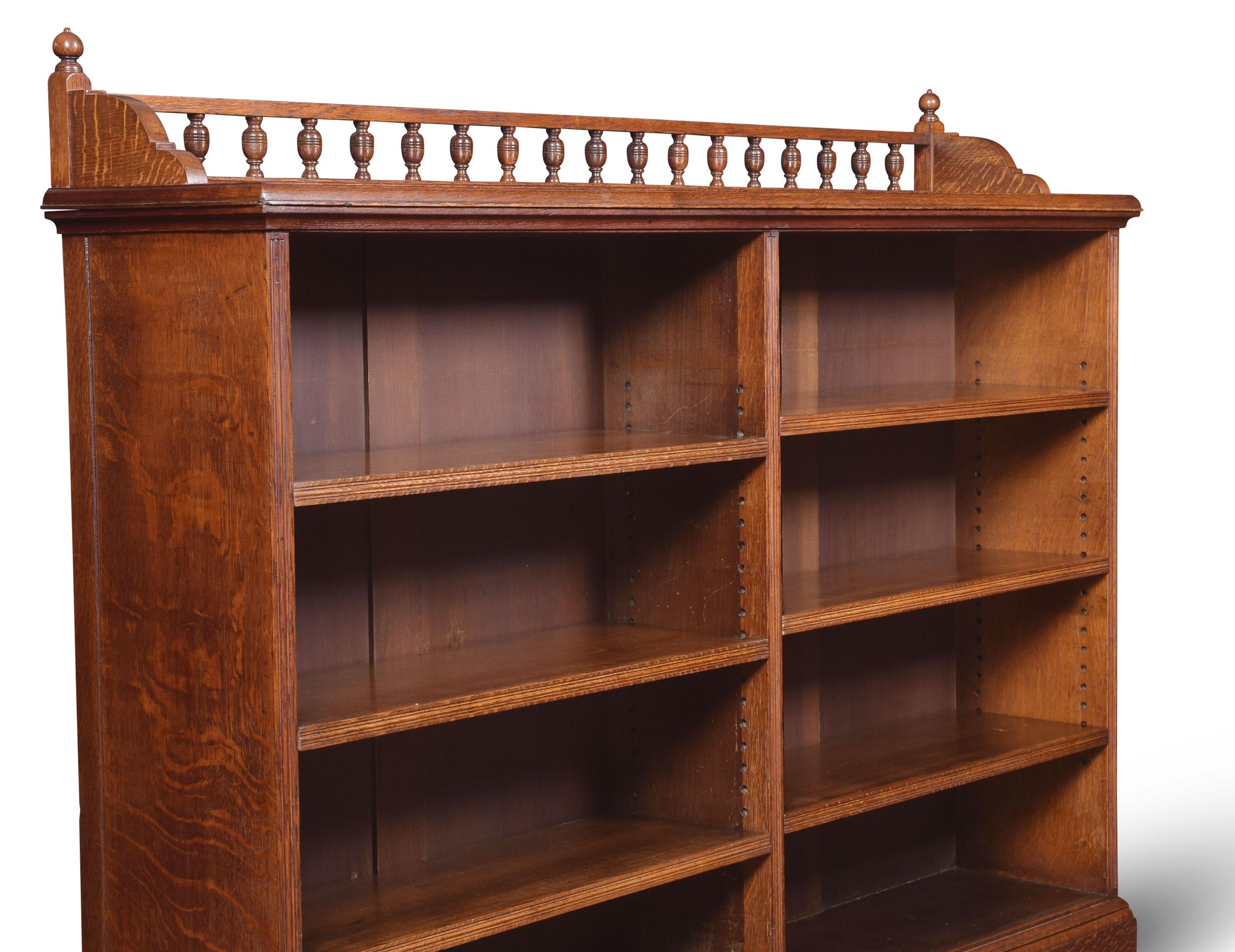 Oak open bookcases, the raised gallery above rectangular moulded top thee bookcase fitted with two separate bays of shelving having three adjustable shelves in each section raised up on plinth base.
Dimensions:
Height 49.5 inches
Width 60