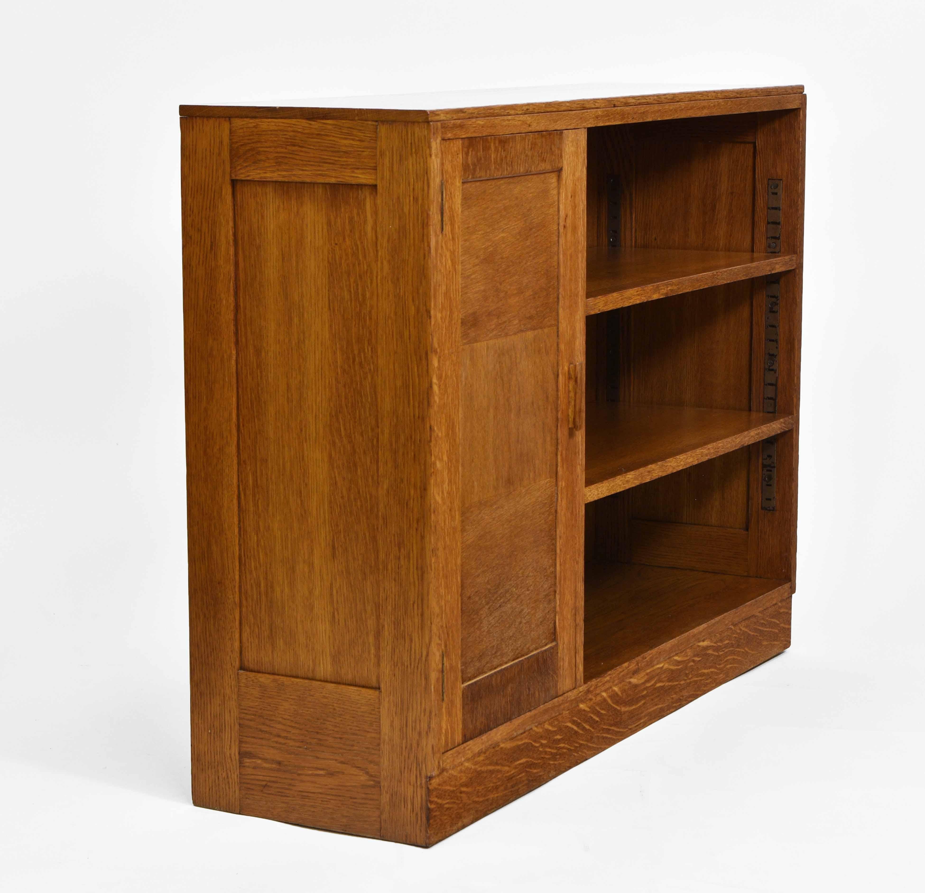 An English Art Deco period oak small open bookcase/cabinet. Retailer's label: Bowman Bros, Camden Town, London. Maker's label: Good Furniture Units - Circa 1930.

*Free delivery for all areas in mainland England & Wales only. Delivery to room of