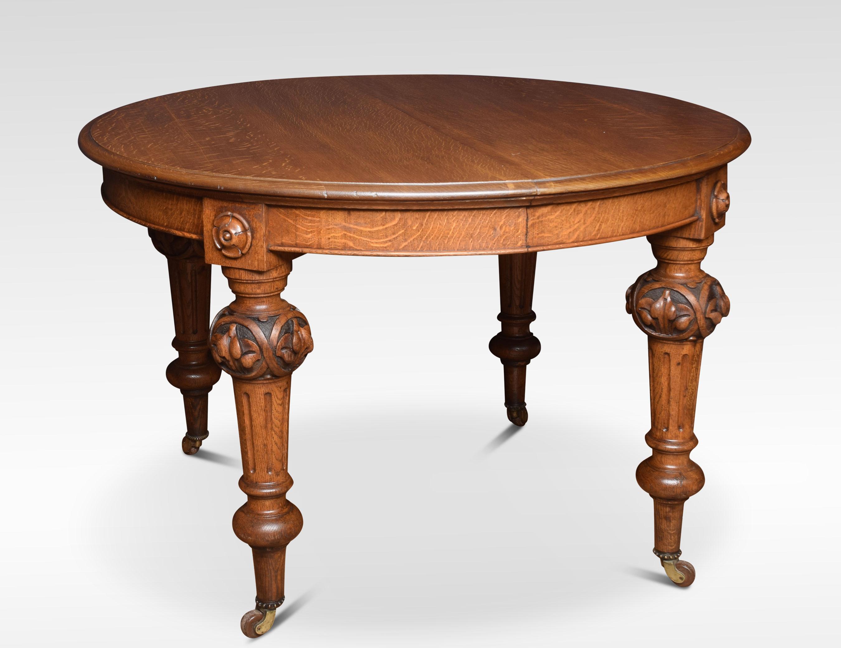 Oak extending dining table, the oval top fitted with telescopic action opening to incorporate two original additional leaves. Raised up on leaf carved and fluted legs with brass caps and casters.
Dimensions
Height 31 inches
Width 48 inches when