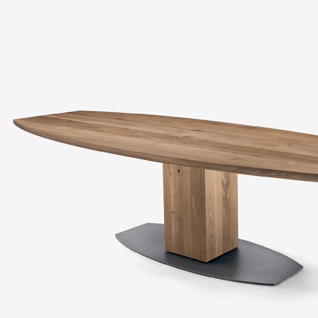 Dining table oak oval T in solid natural
oakwood and with lacquered iron base.
Base made in on block of oakwood.
Oak treated with natural pine extracts
wax.
Available in:
L 200 x D 100 x H 73.5cm, price: 11900,00€ 
L 220 x D 100 x H 73.5cm, price: