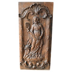 Oak Panel Carved In High Relief Representing Saint Luke, Circa 1700