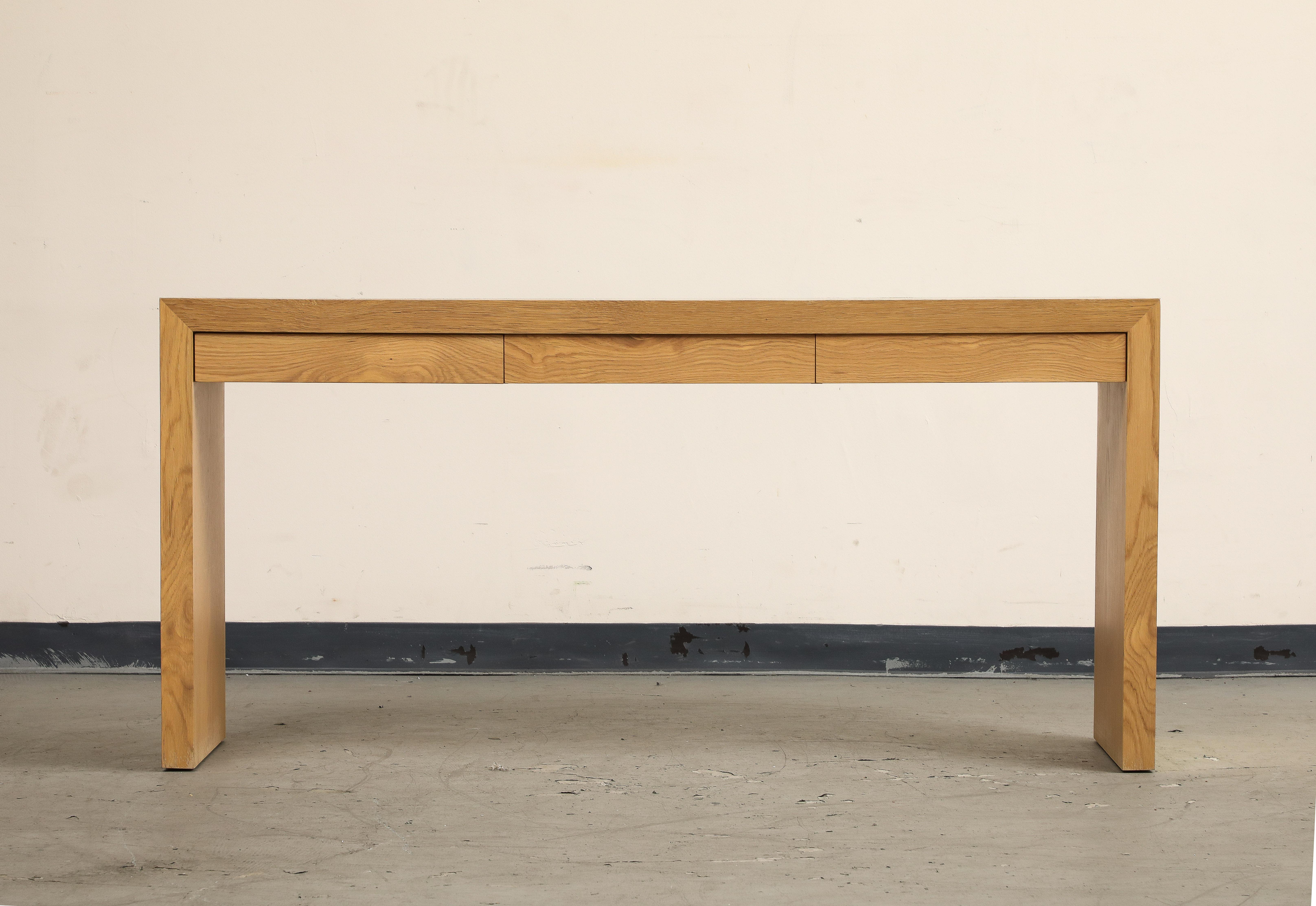 Contemporary oak waterfall Parkman console with three drawers, by Lawson-Fenning. Made in Los Angeles. 

Additional dimensions: 
drawers 2.5
