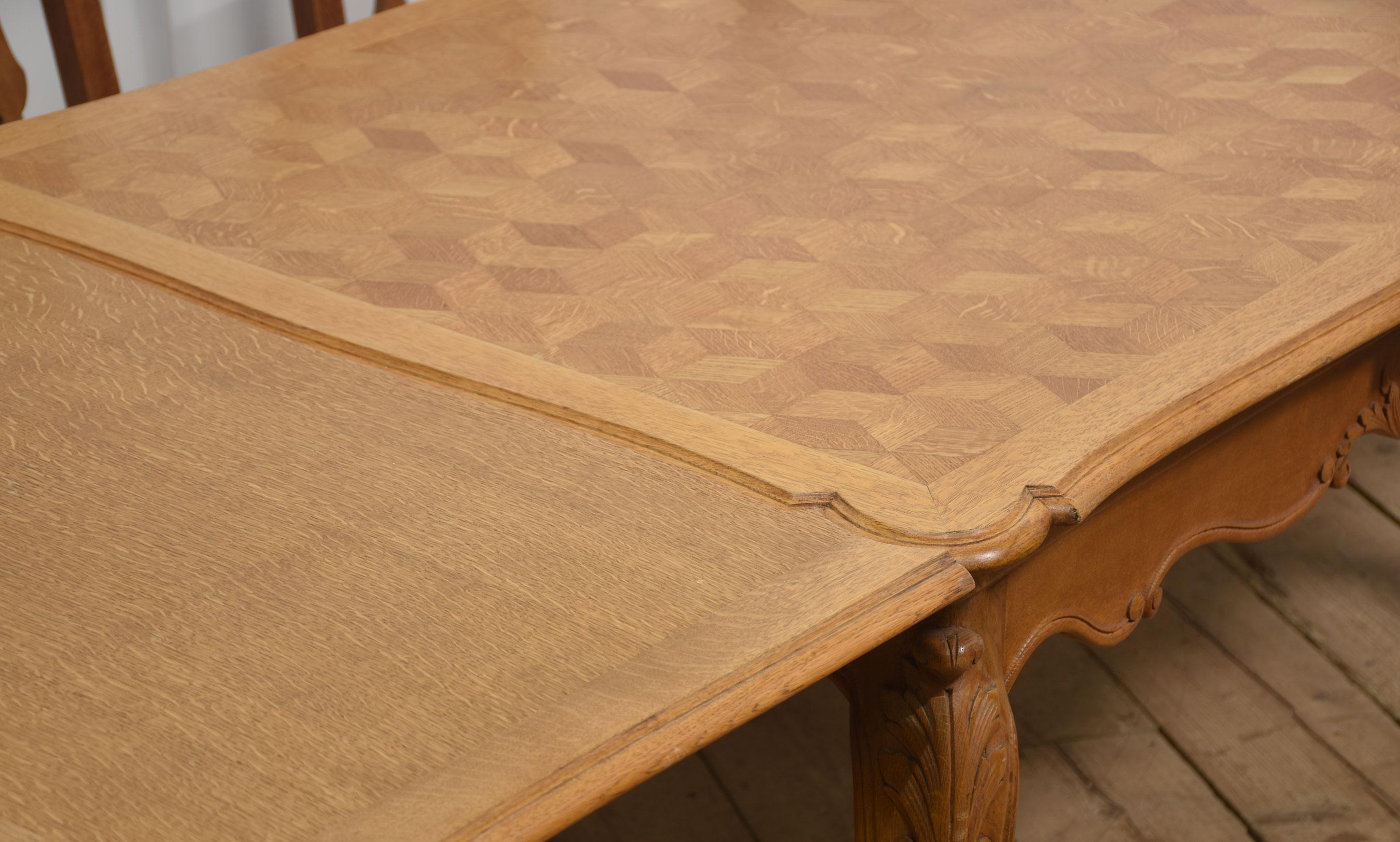 French Provincial style draw leaf dining table, the oak parquet top with two pull-out leaves above the shaped carved apron. All raised up on cabriole legs.
Dimensions
Height 30.5 Inches
Width 59.5 Inches when open 105 Inches
Depth 39 Inches