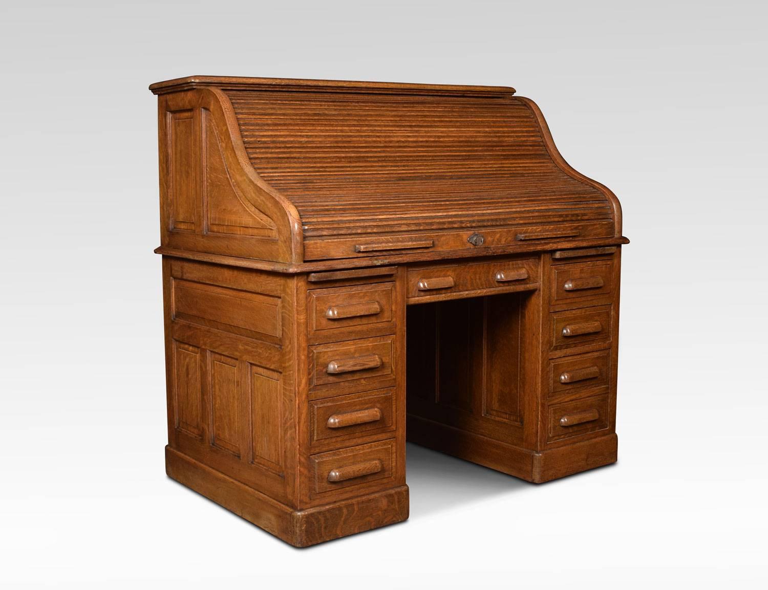 Oak double pedestal roll top desk, the high back with fitted interior of pigeon holes and drawers, the centre drawer flanked by pedestals one with four short draws the other with two short and one double draws raise up on plinth
