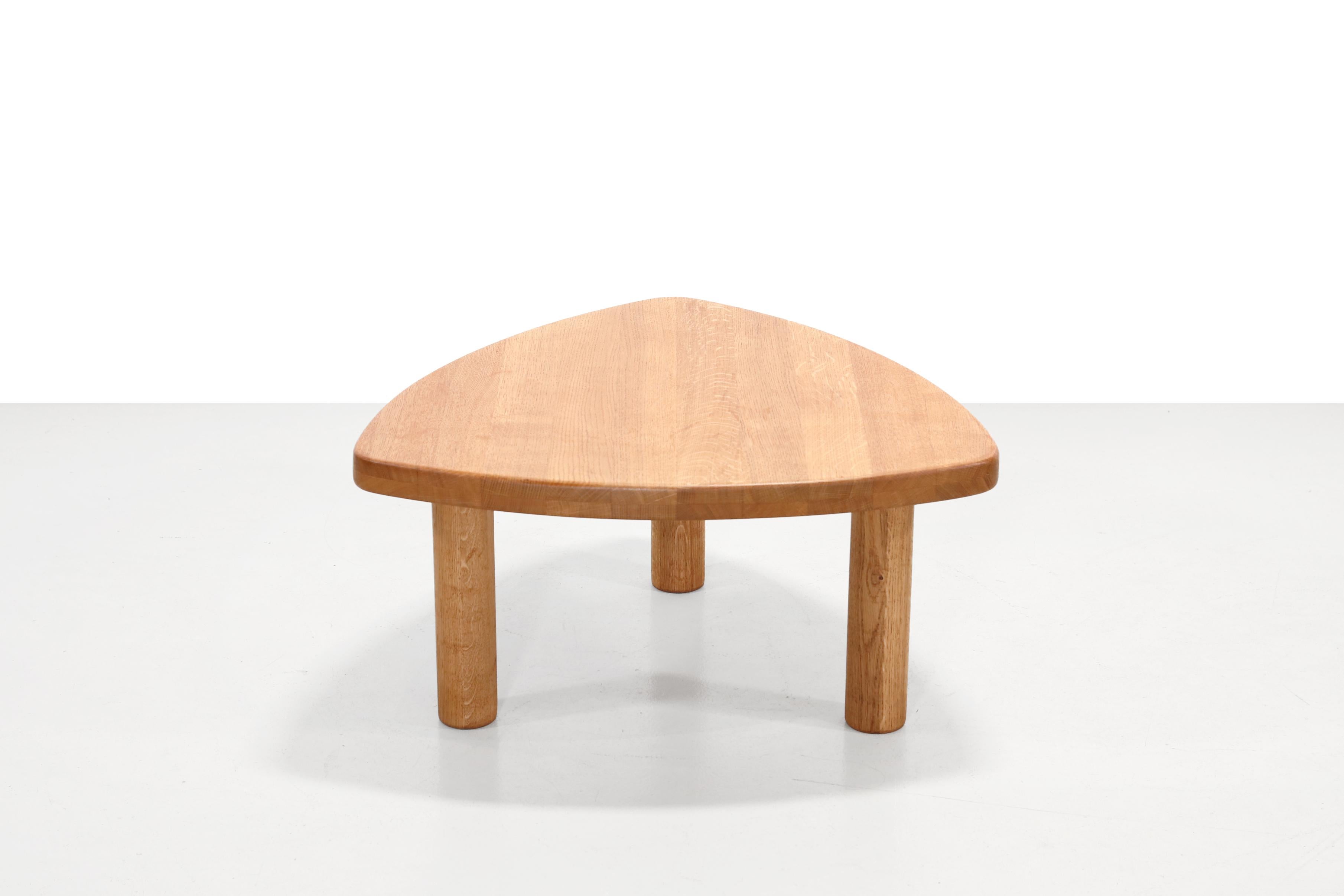 Vintage oak side table attributed to Pierre Chapo, with the iconic tripod design.  The solid oak top and the playful minimalist shape make it a timeless and multifunctional addition to any room.  It is a beautiful old table, which a specialist has
