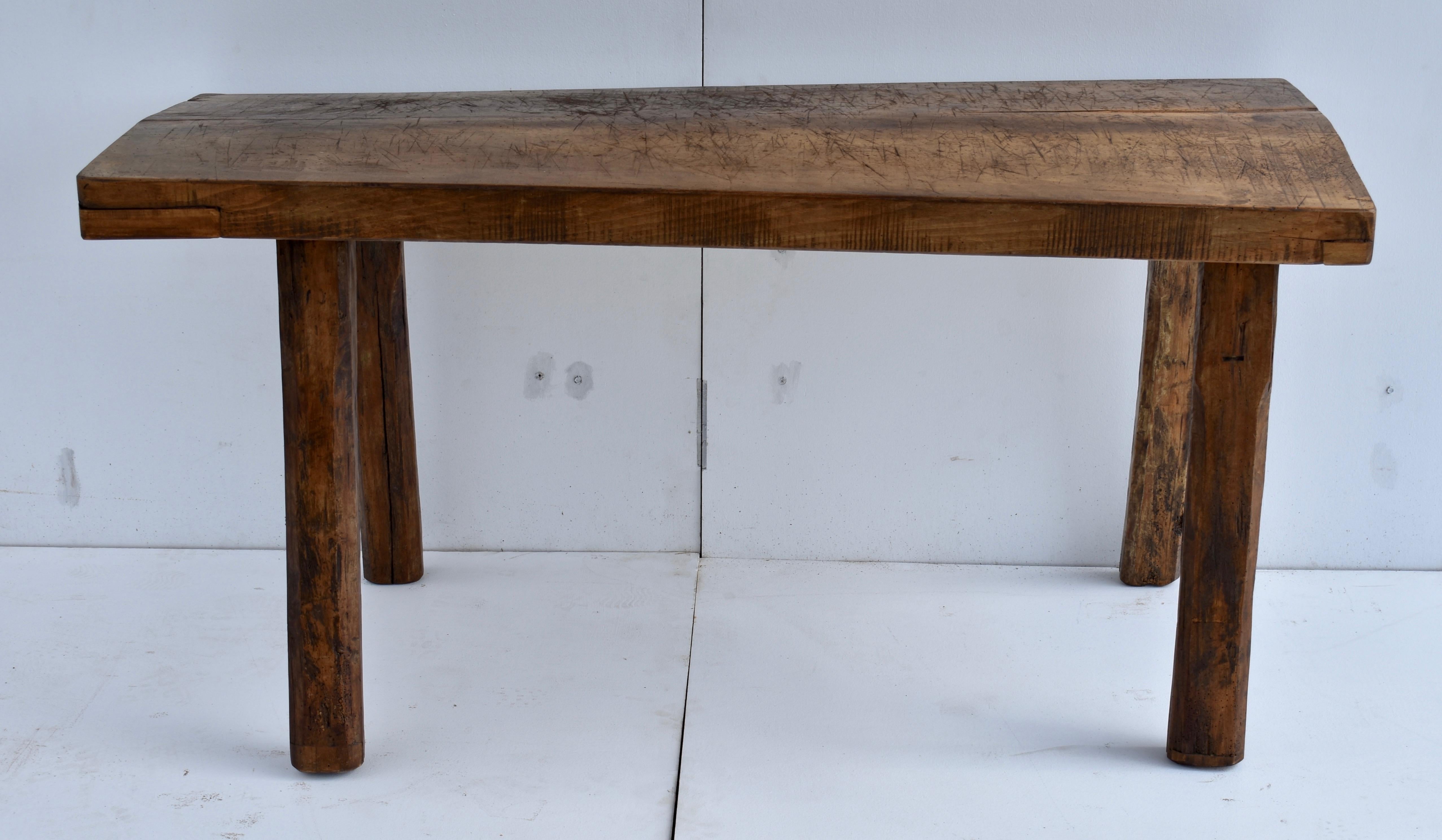 This rather elephantine Pig Bench has a number of interesting features. The top is a massive slab of oak almost 3” thick, which over the years has developed a hump and a twist. The legs have been trimmed to compensate, so it still stands perfectly