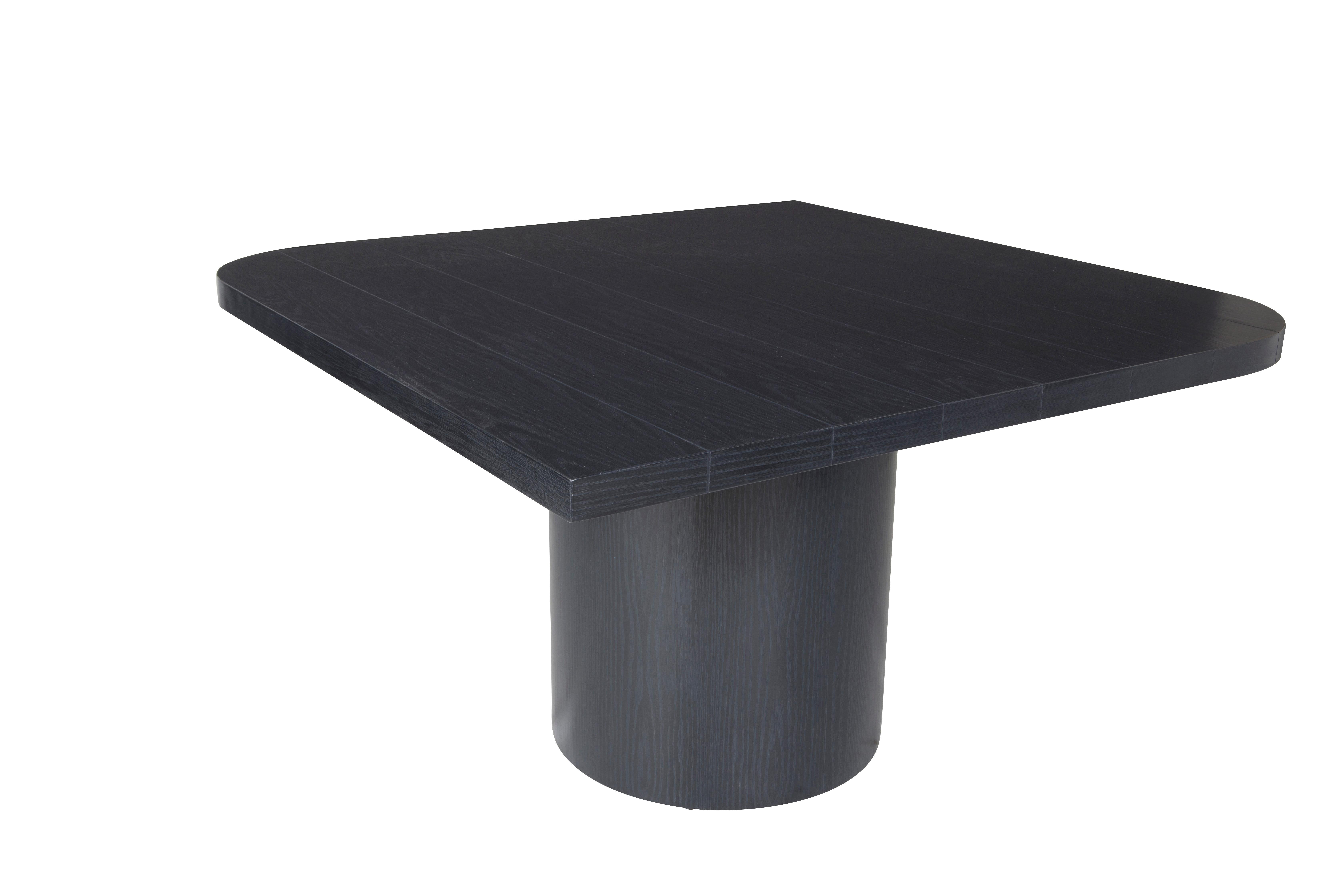 This custom game table features a plank top with opposing curved and angular edges. Set atop a round wooden base. Photos show the piece in an onyx oak. 

Designed by Brendan Bass for the Vision and Design Collection, by using high quality materials