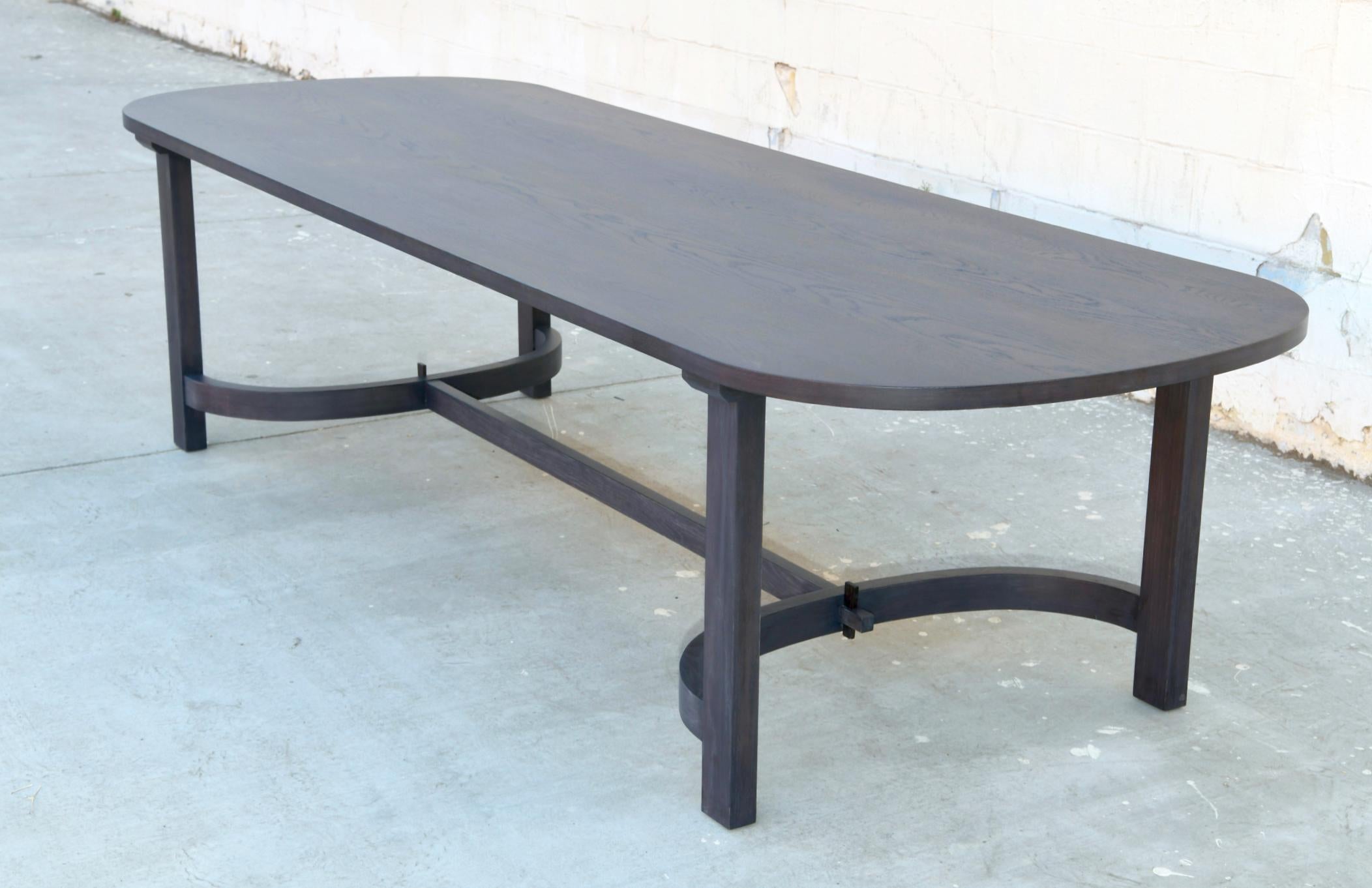 This ebonized racetrack table, designed in collaboration with Jake Alexander Arnold, is seen here in 120