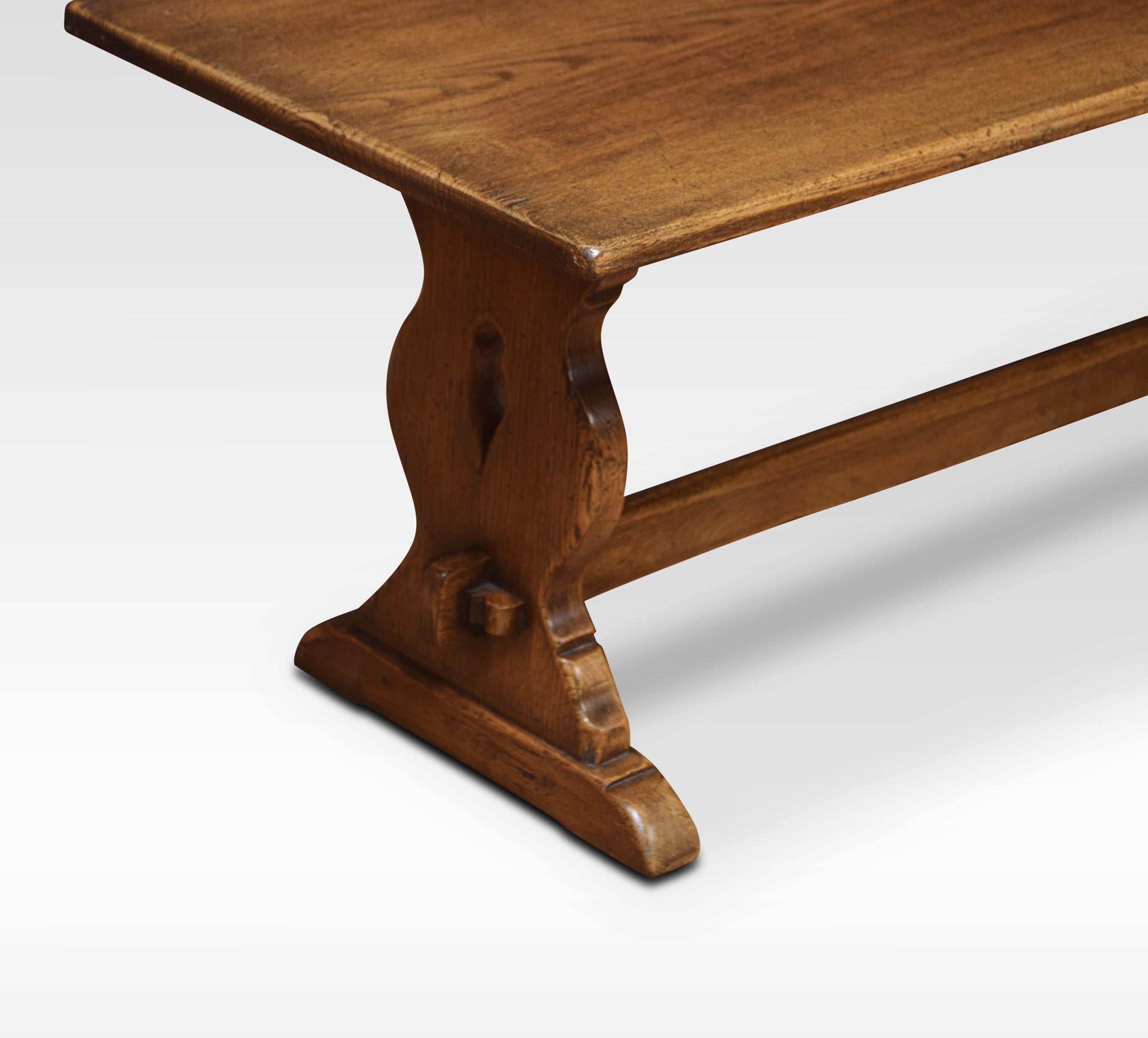 Oak refectory coffee table, the rectangular top, raised on platform end supports with trestle legs united by stretcher.
Dimensions:
Height 17 inches
Width 41 inches
Depth 17 inches.