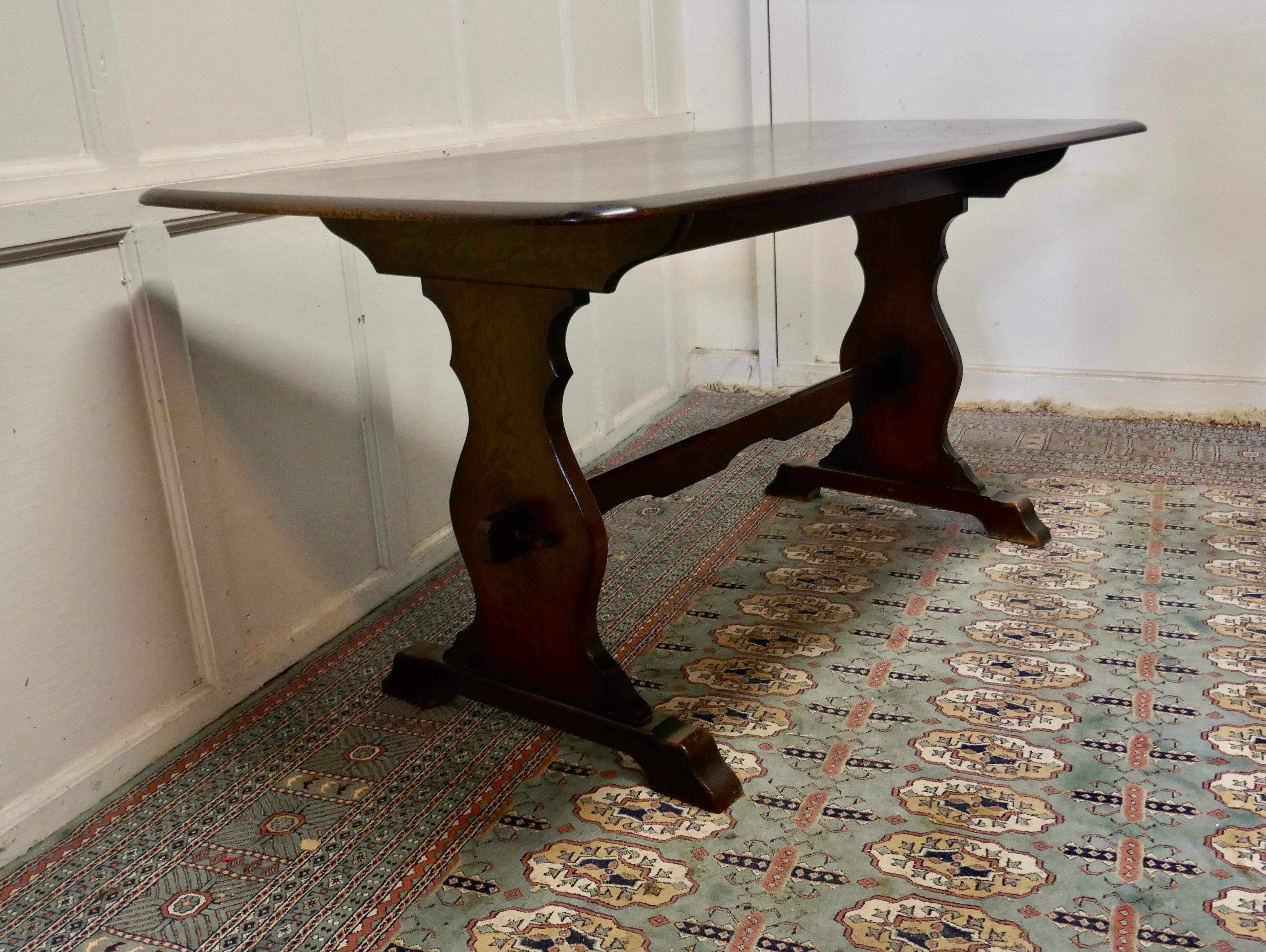 Oak refectory table by Webber of Croydon 

This is a superb piece it is a good quality oak country table, a refectory style table, the table has a 5 plank top and legs are in oak
 
The table is a beautiful deep colour, it has a good finish, it