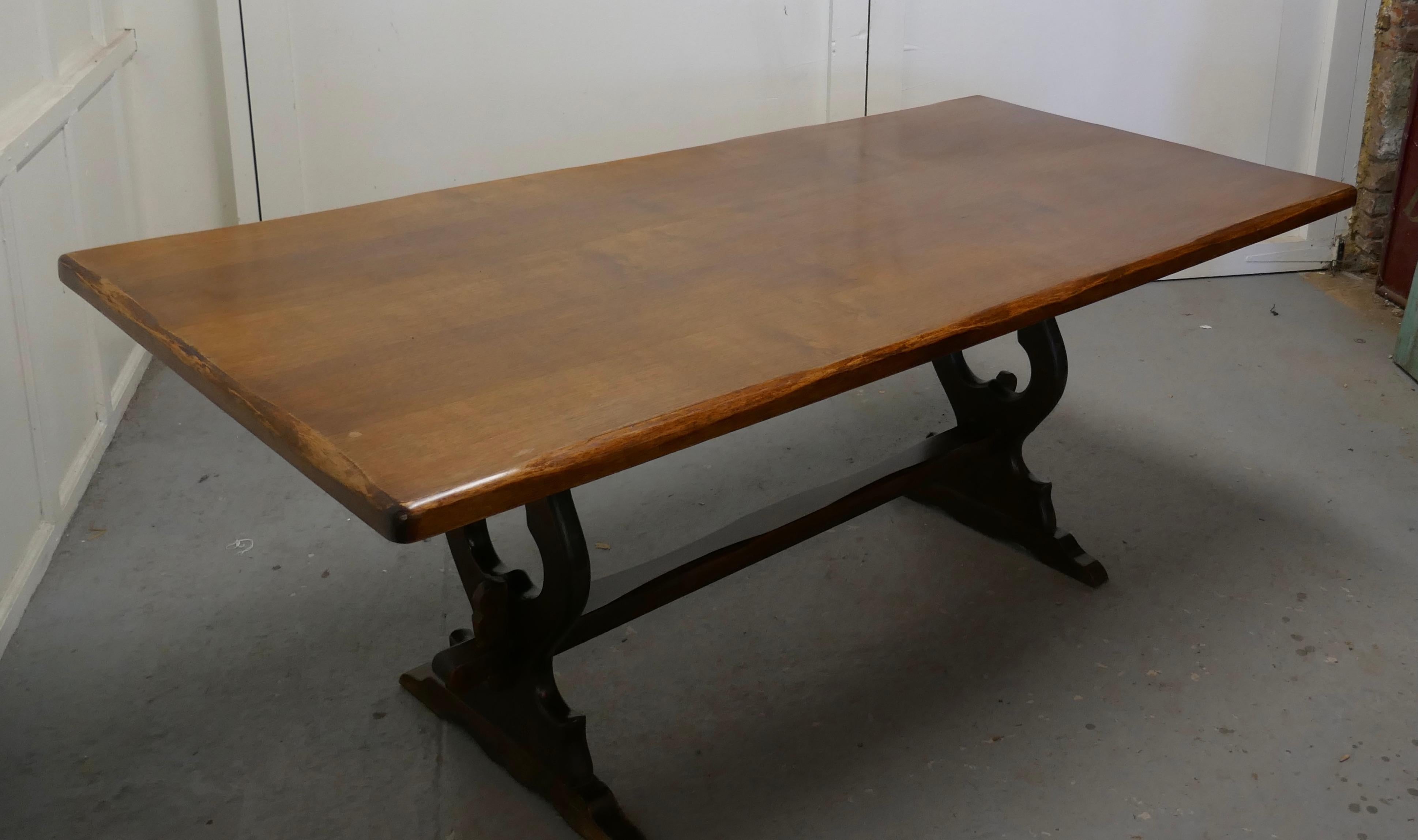 Oak refectory table

This is a superb piece it is a very heavy oak country table, a refectory style table, the top is 2” thick, with a slightly wavy chamfered edge 
 
The table is a beautiful deep colour, it has a good finish, it is sound and