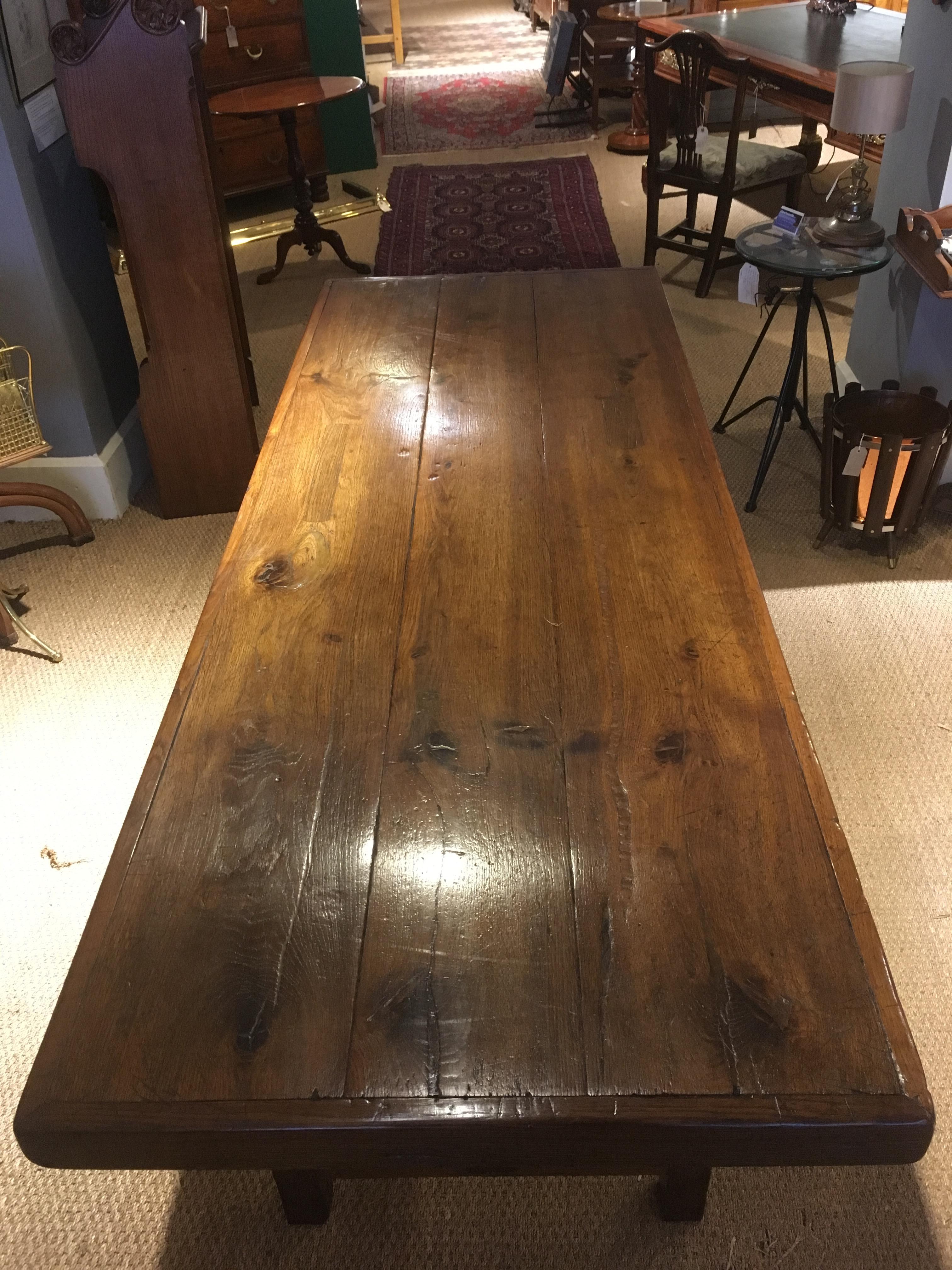 The most wonderful mid-19th century oak refectory table.

Dating to circa 1850s, the planked top standing on an H stretcher base 

This table oozes charm and character, the table has had a number of repairs over the years but this only adds to