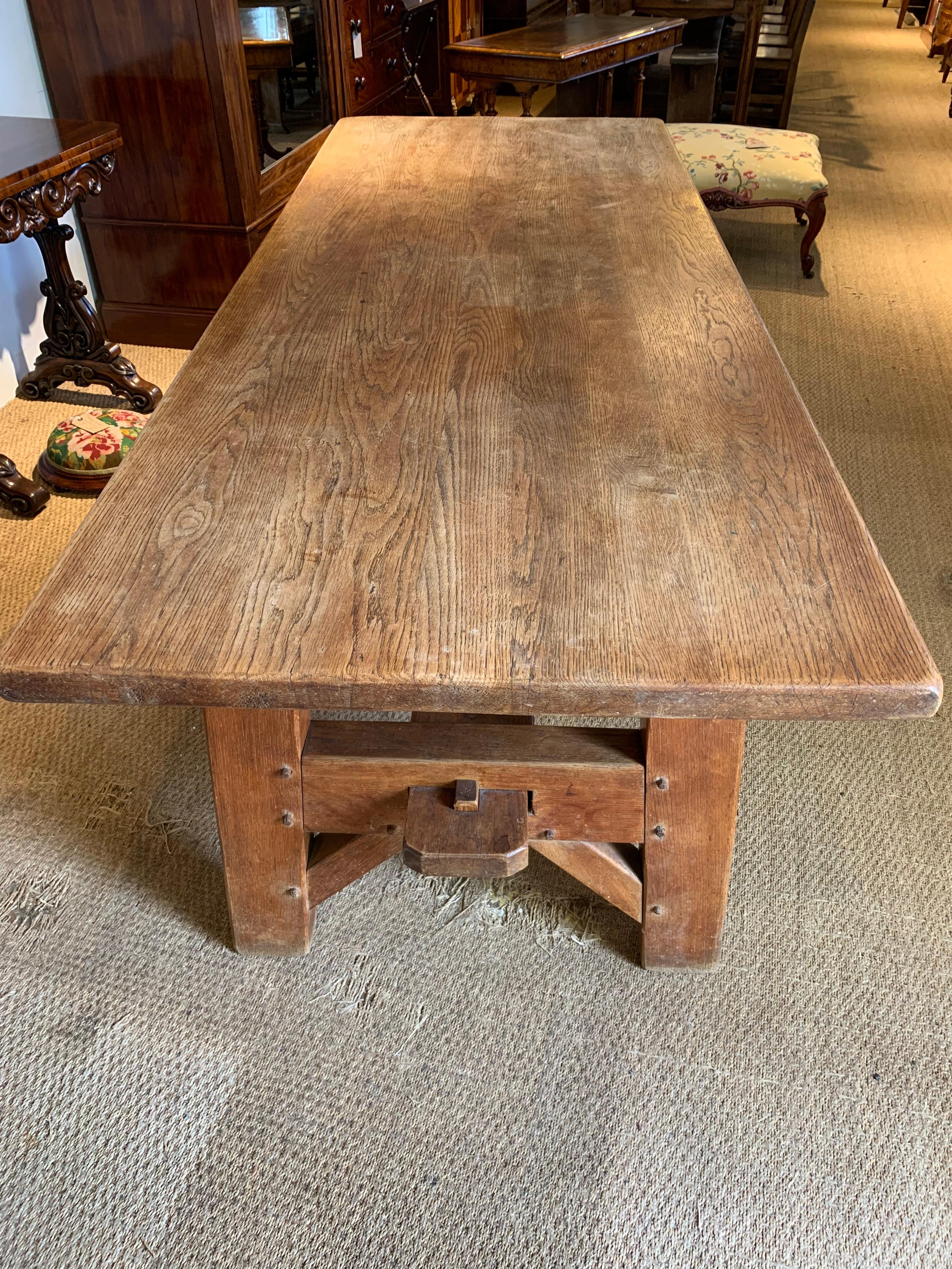 Fabulous industrial style Refectory table, constructed from solid oak, dating from circa 1890s this table will easily seat 8 people, bags of legroom as 29 inches under the top ( no rail on this table).

Measures: Height 31 inches 
Width 33 inches