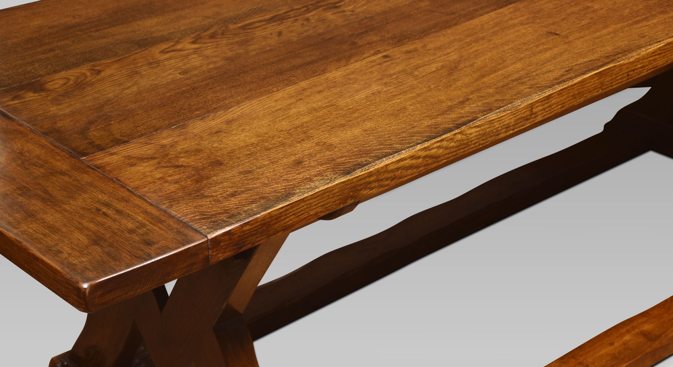 Large oak refectory table, the thick top with cleated ends raised up on square and compass slab ends united by stretchers.
Dimensions
Height 30 Inches
Width 100 Inches
Depth 32.5 Inches.