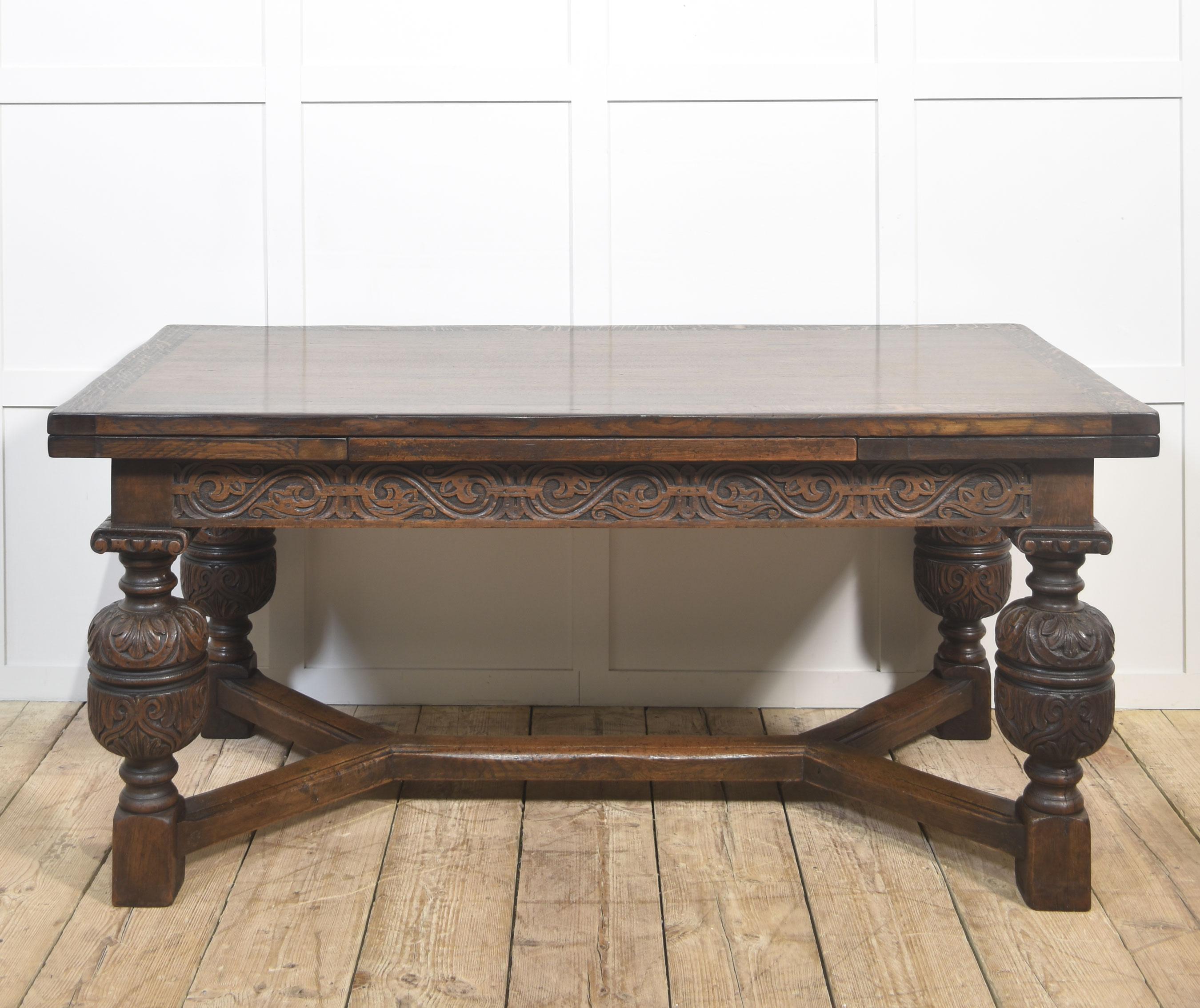 A superb antique oak refectory table featuring a rectangular top with pull-out leaves at each end, allowing the table to extend with ease for additional seating. Crafted from solid oak, the table showcases a rich, warm patina and beautiful
