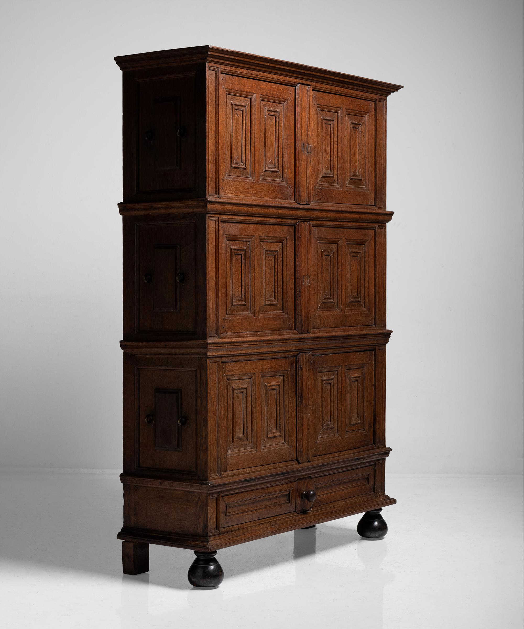 Oak Renaissance cabinet, Netherlands, circa 1650.

Constructed in oak. Made in three sections, each section having its original bronze carrying handle on the side.

Measures: 59.75” W x 20.75” D x 87.25” H.