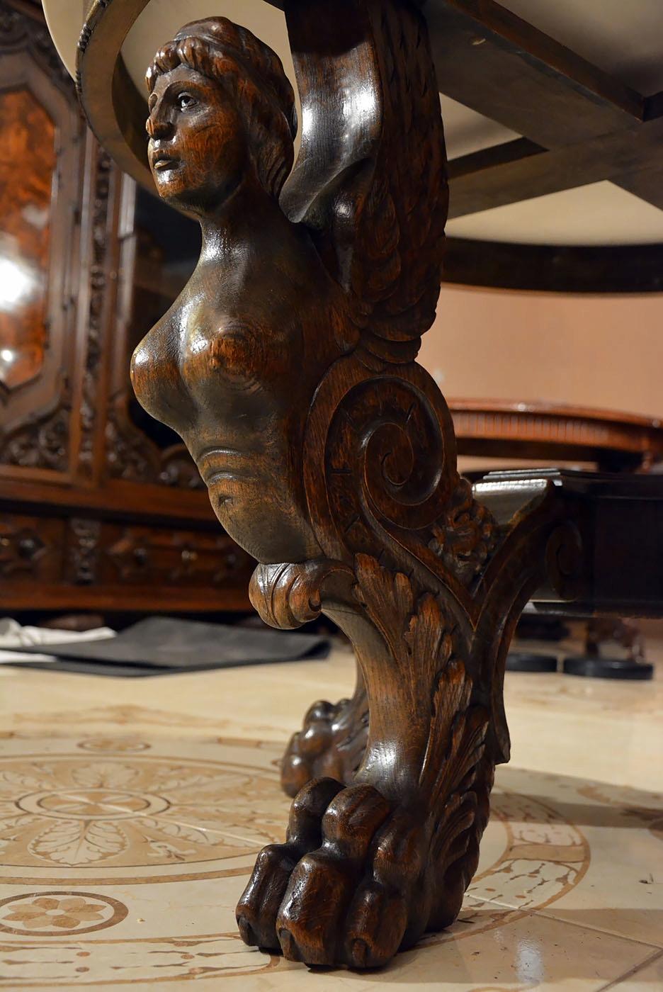 A unique Renaissance Revival table dated to the beginning of the 20th century.

Made of oakwood.

Characterized by an extremely detailed sculpture and woodcarving.

The table is supported by four incredibly carved supports in the form of