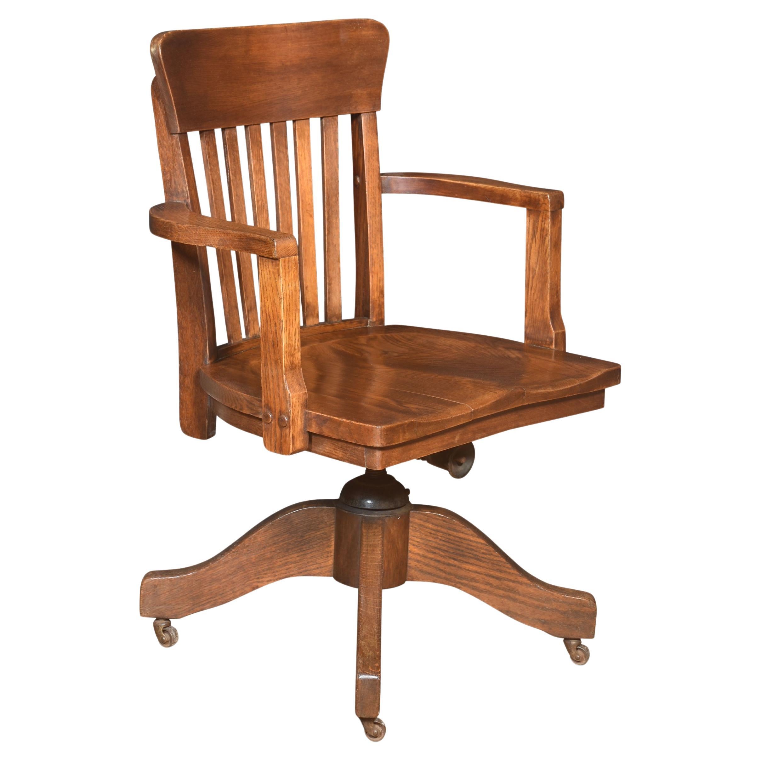 Oak revolving desk chair For Sale